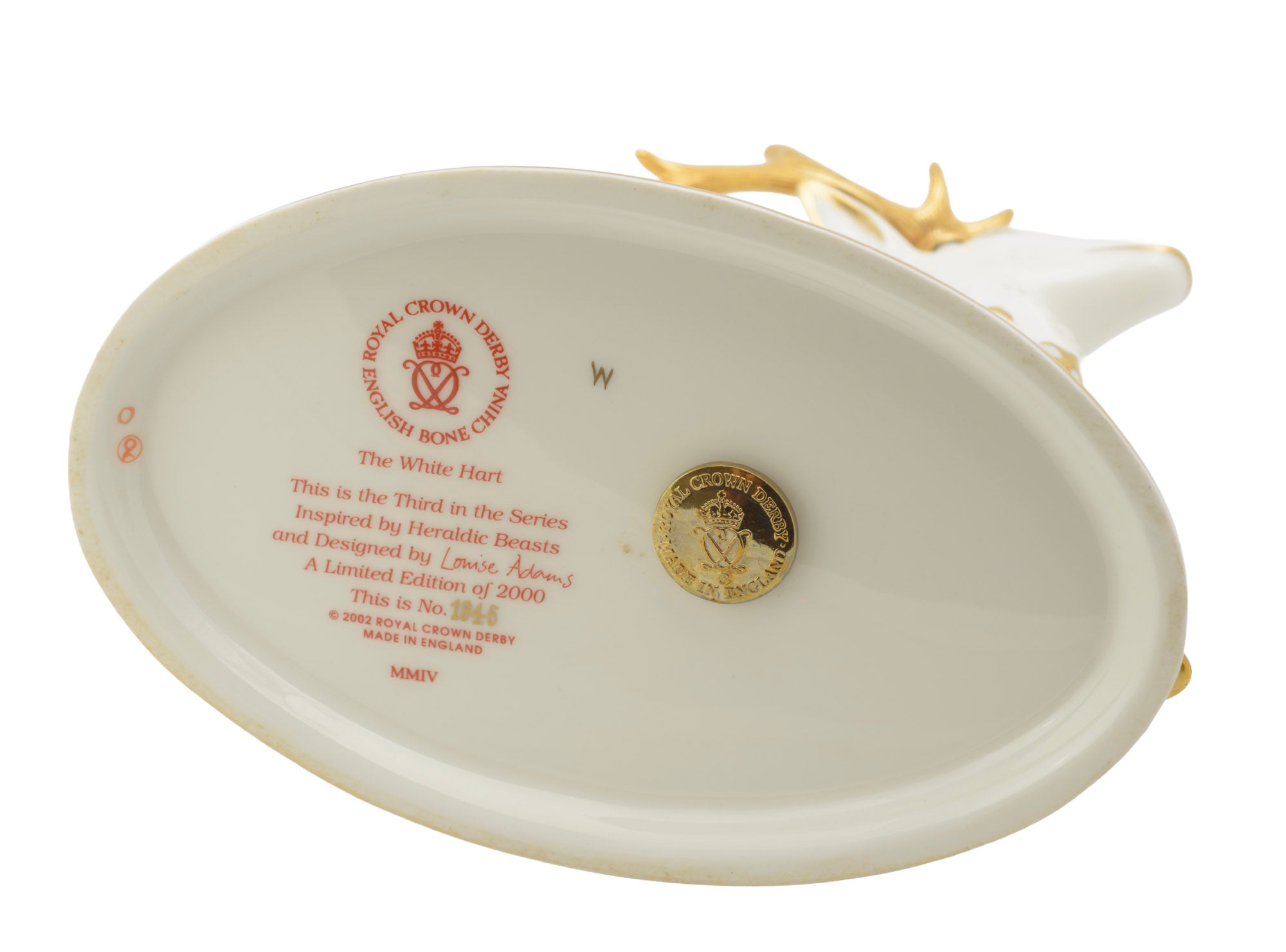 Royal Crown Derby The White Hart paperweight - underside showing factory mark, Louise Adams designer credit, limited edition of 2000 and gold stopper