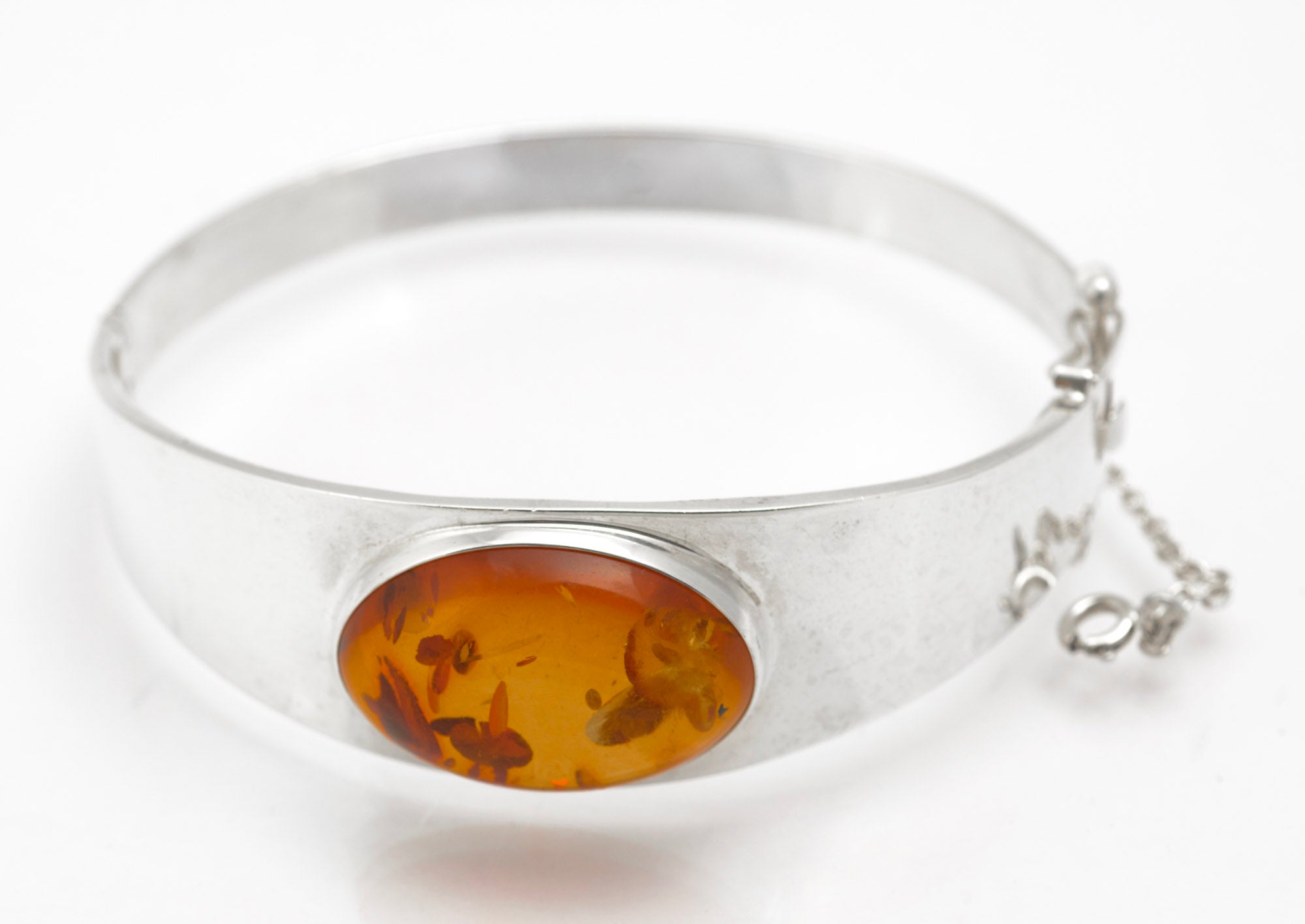Vintage Sterling Silver and Amber Bangle - reverse showing sliding box clasp detail on grey background