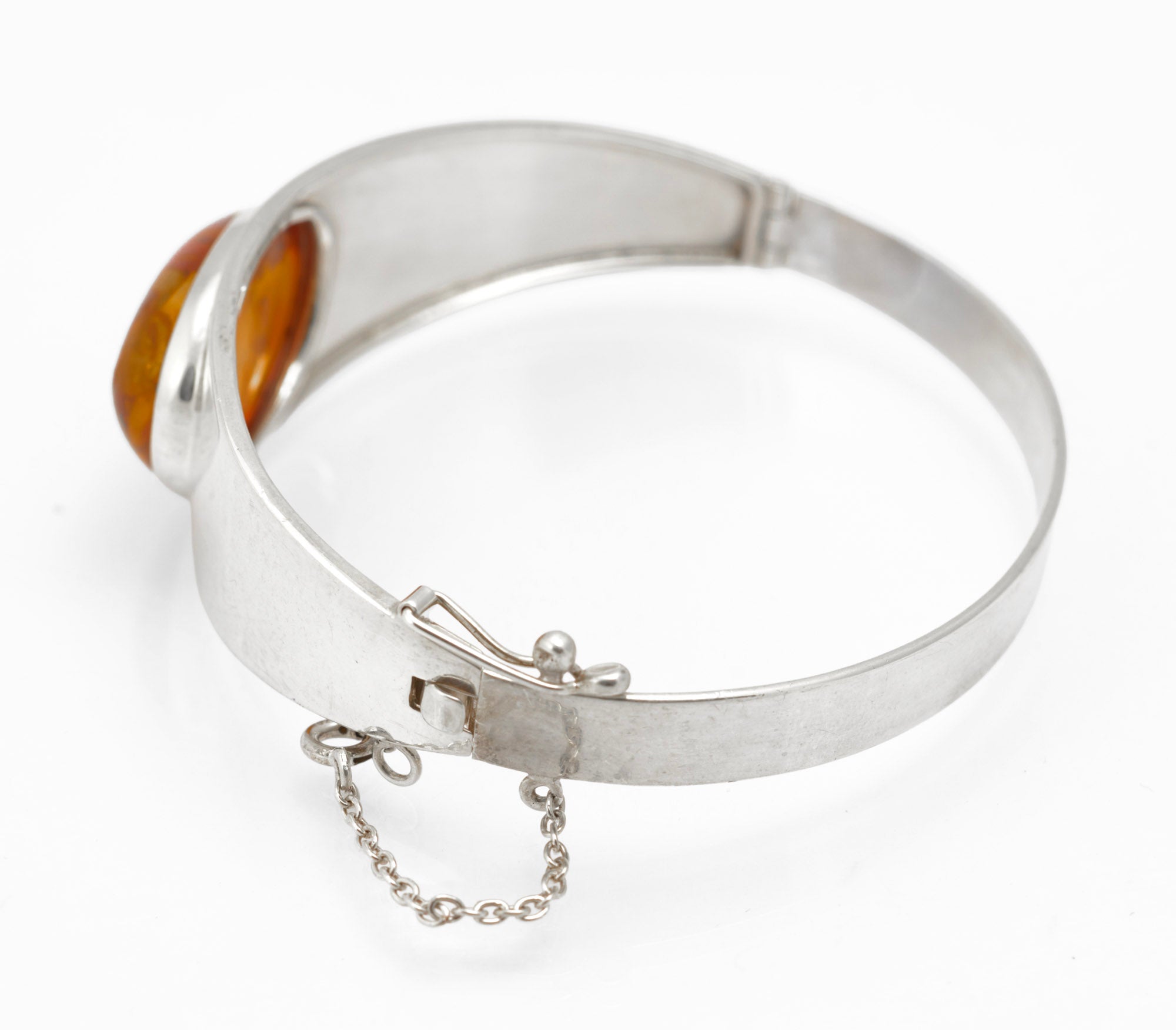Vintage Sterling Silver and Amber Bangle - three-quarter view showing amber and band profile on grey