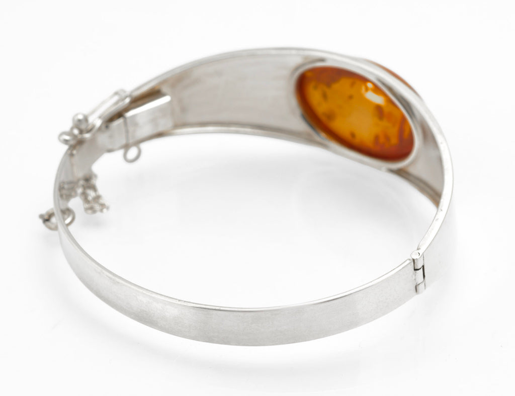 Vintage Sterling Silver and Amber Bangle - side profile view on white background