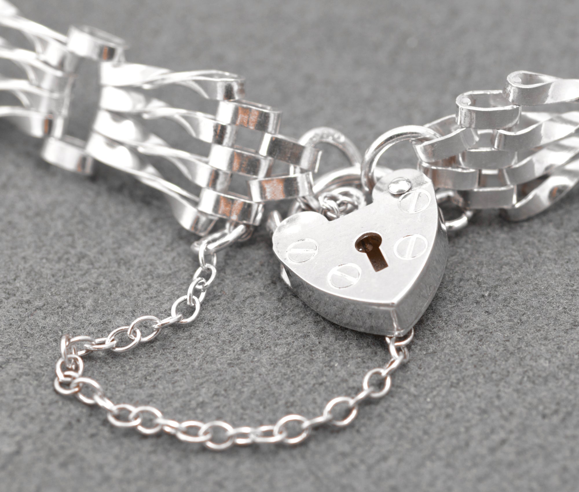 Vintage Sterling Silver Gate Bracelet - close-up of heart padlock clasp and safety chain detail