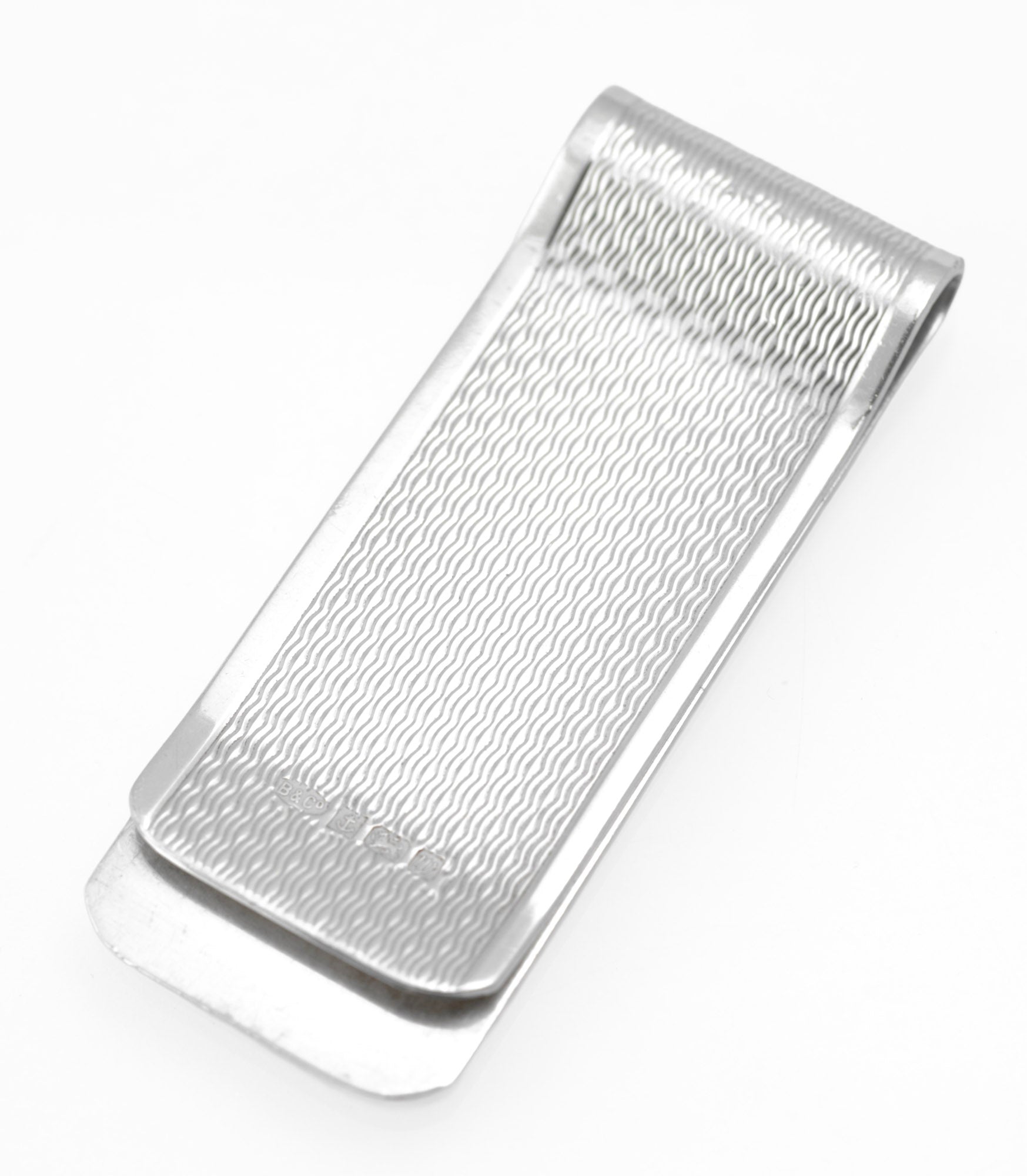 Vintage Sterling Silver Engine Turned Money Clip - three-quarter view showing engine turned surface and polished borders