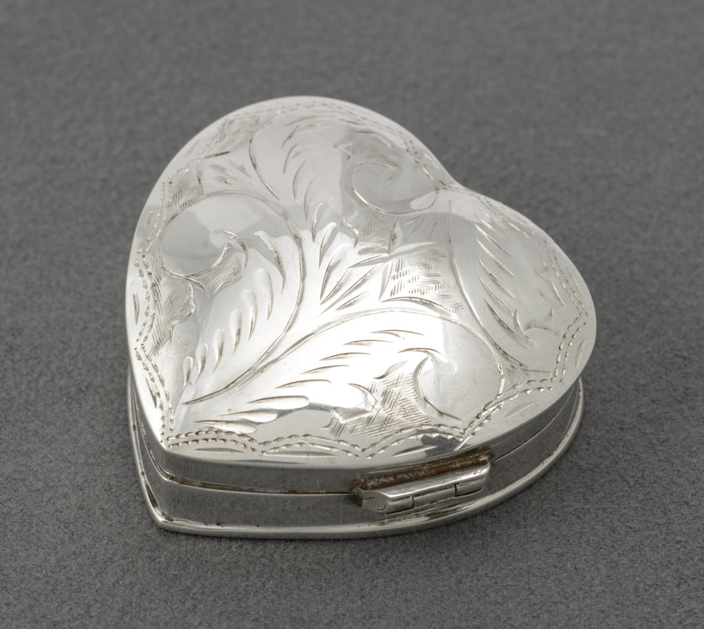 Vintage sterling silver heart shaped trinket box - reverse showing plain polished underside with hallmarks
