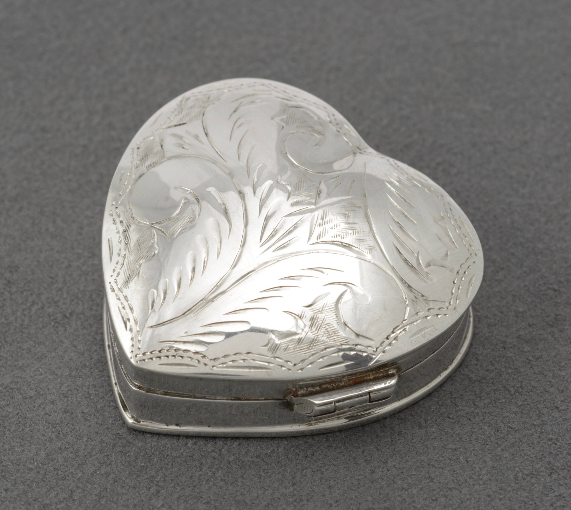 Vintage sterling silver heart shaped trinket box - reverse showing plain polished underside with hallmarks
