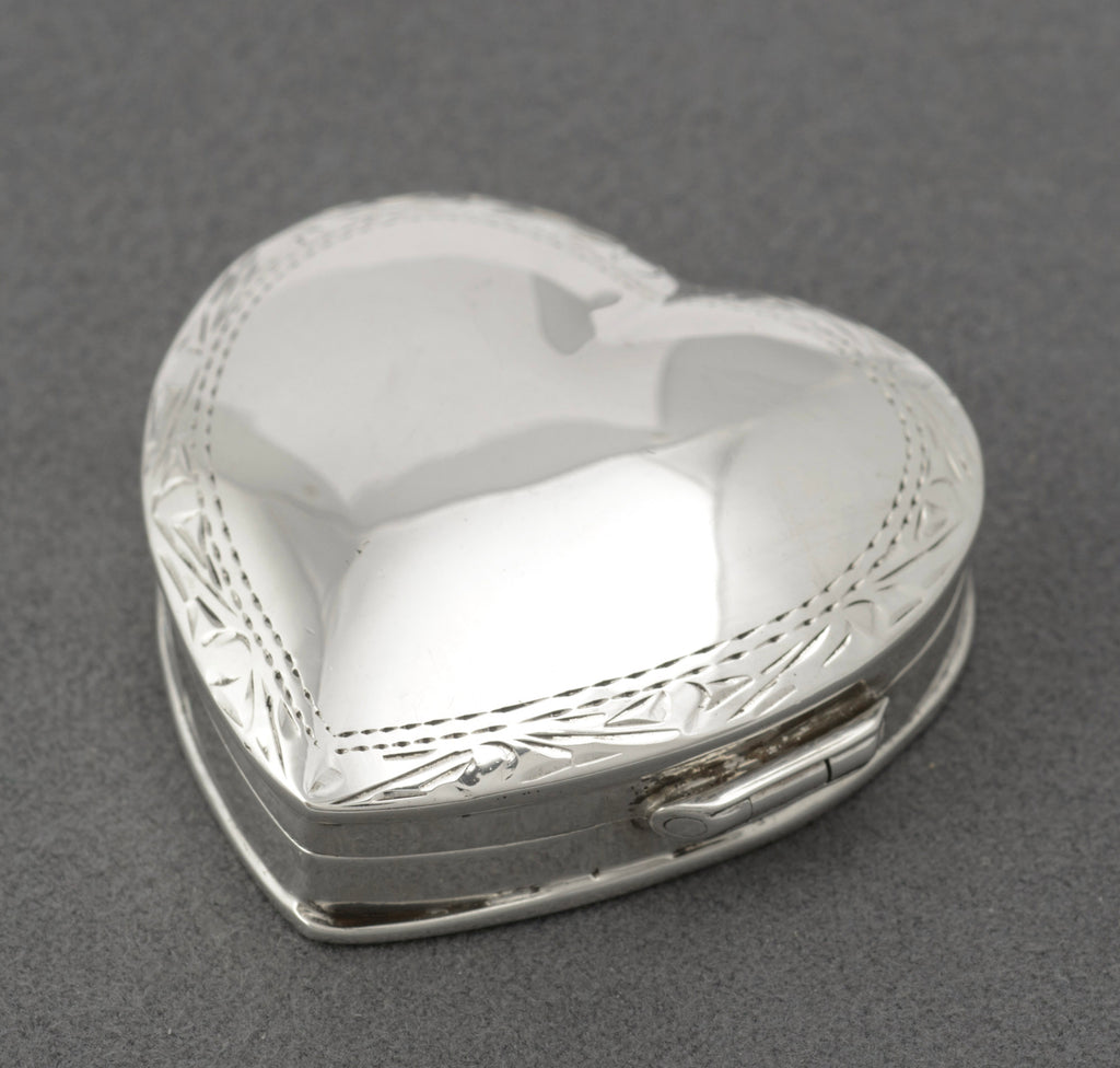Vintage sterling silver heart shaped trinket box open showing plain polished interior, London 1993