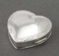 Vintage sterling silver heart shaped trinket box open showing plain polished interior, London 1993