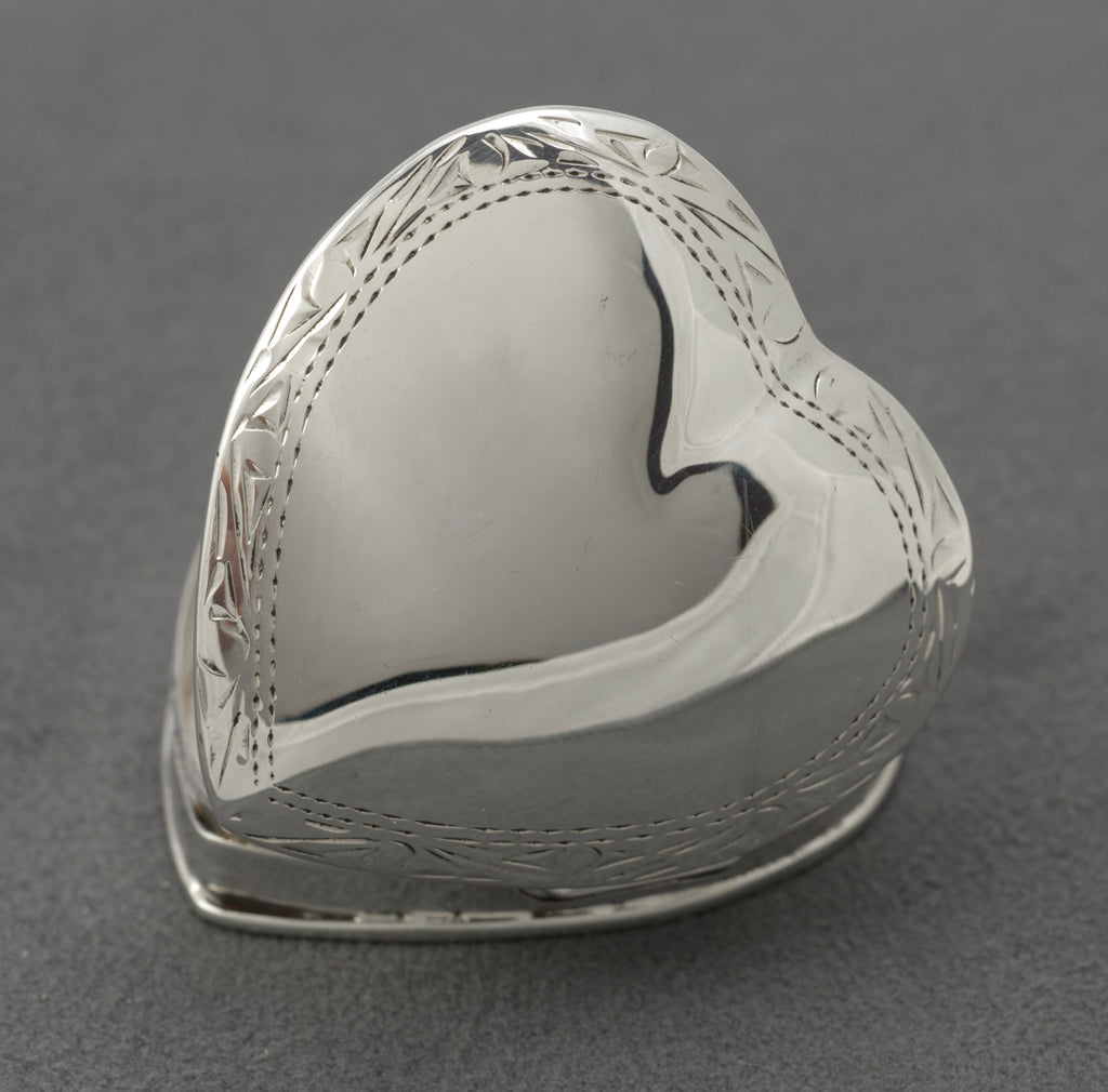 Vintage sterling silver heart shaped trinket box - close-up of hallmarks showing sponsor mark, 925 standard and London import date letter 1993