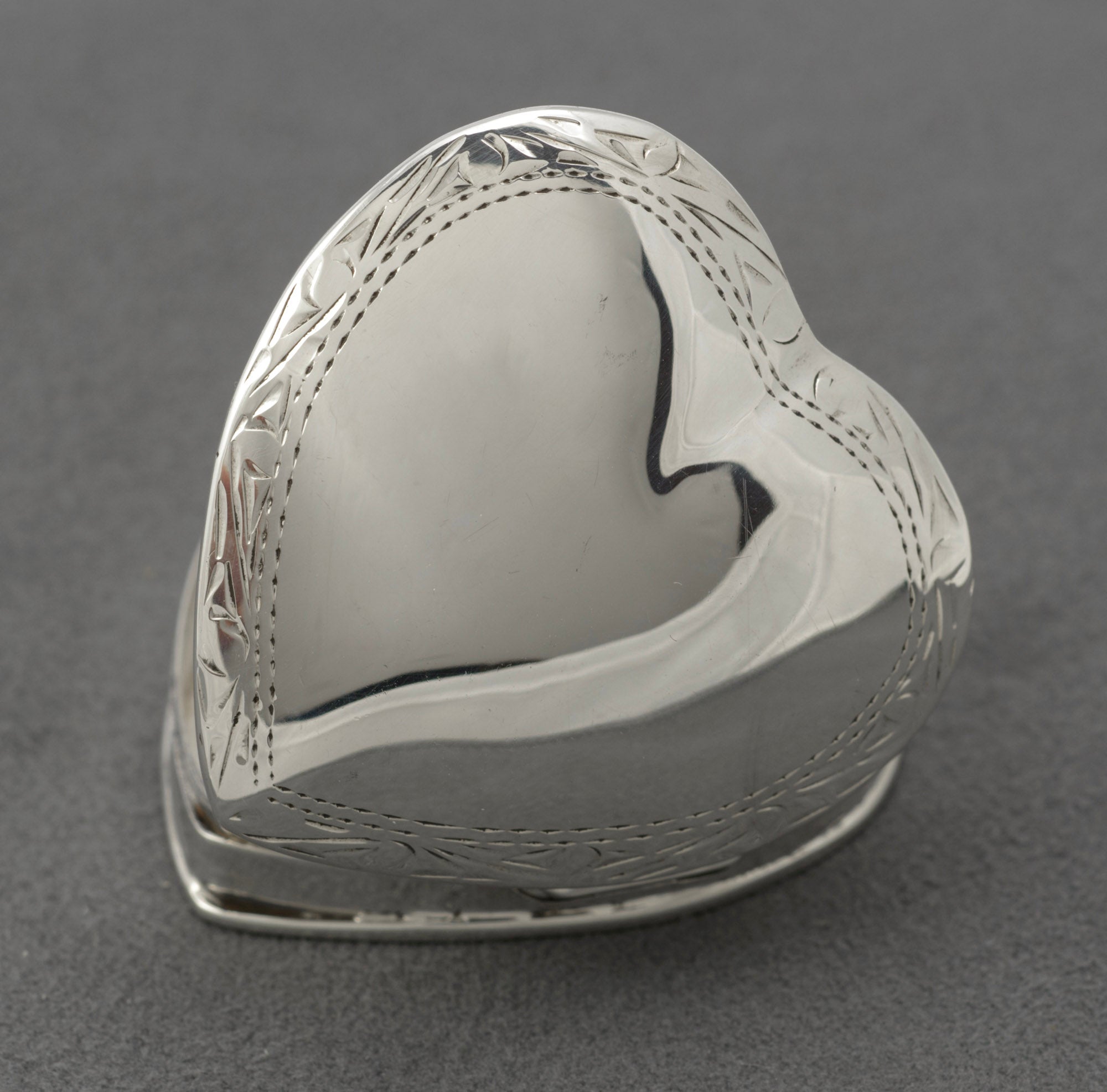 Vintage sterling silver heart shaped trinket box - close-up of hallmarks showing sponsor mark, 925 standard and London import date letter 1993