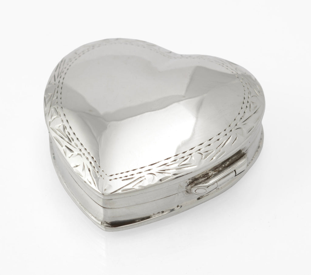 Vintage sterling silver heart shaped trinket box - front view closed showing heart form and engraved decoration