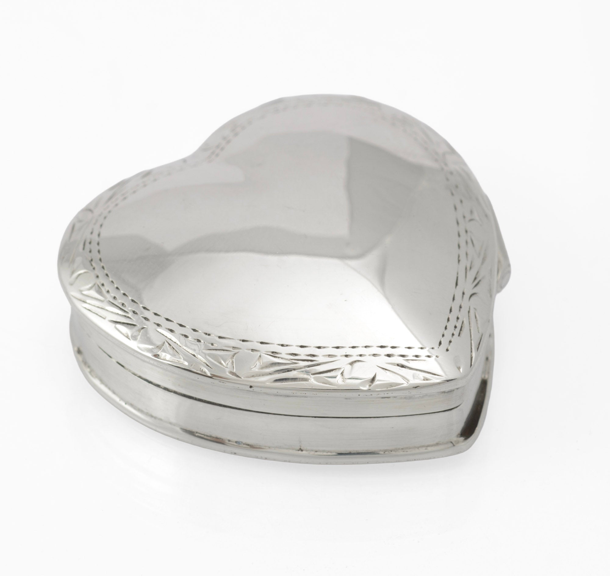 Vintage sterling silver heart shaped trinket box - angled view showing lid and base construction