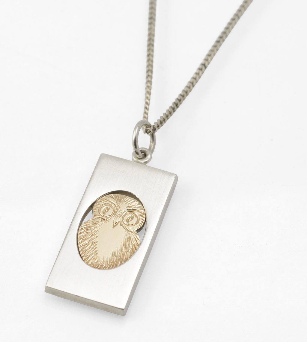 Vintage Finnish sterling silver owl pendant necklace - close-up of rectangular pendant showing gold-coloured owl detail on curb chain