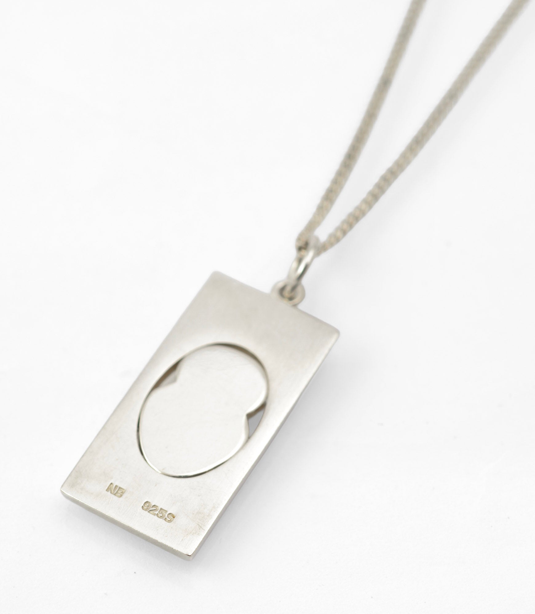 Vintage Finnish sterling silver owl pendant necklace - full length view on white background showing 40cm curb chain and rectangular pendant