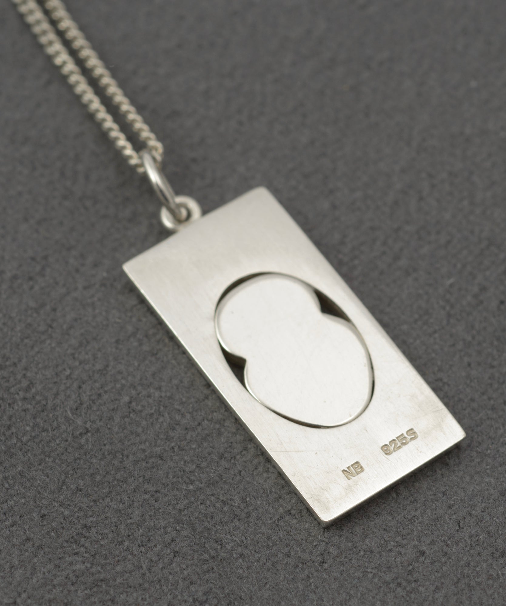 Vintage Finnish sterling silver owl pendant - close-up of reverse showing NB 925S mark struck to lower edge of rectangular pendant
