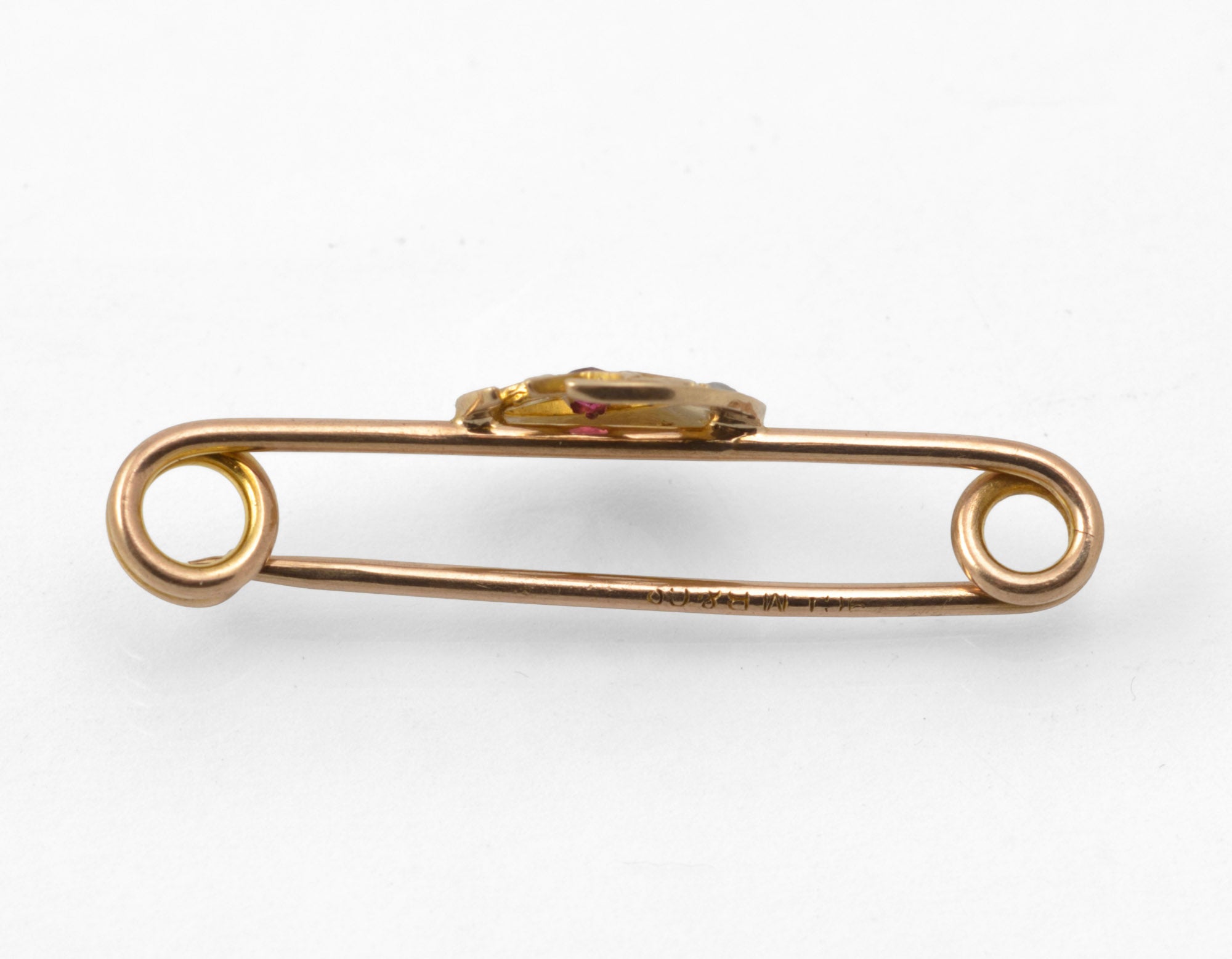 Antique Victorian 9ct gold honeymoon brooch - close-up of crescent moon with graduated split pearls and red paste star