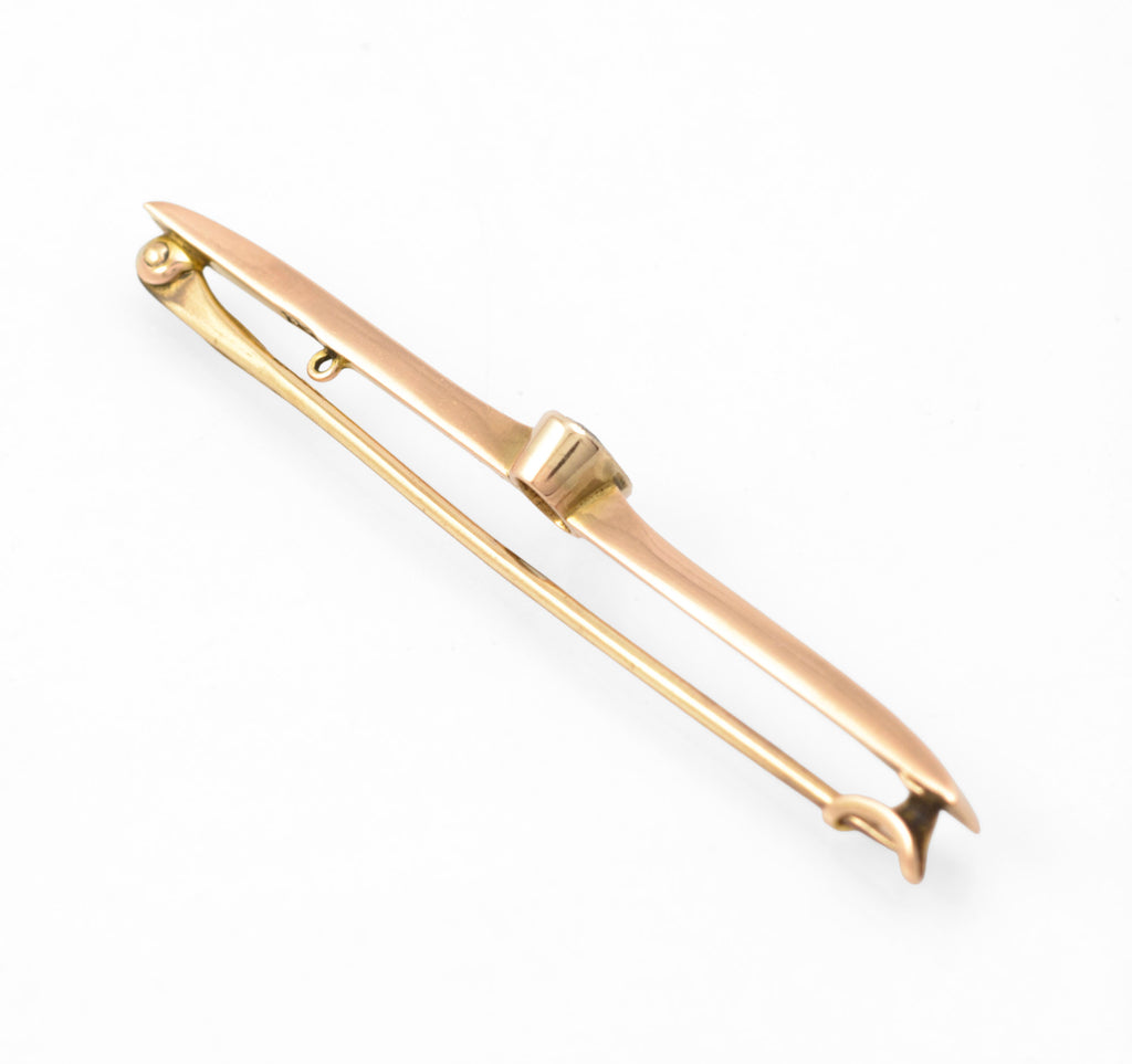 Art Deco 9ct rose gold aquamarine bar brooch - reverse three-quarter view showing pin mechanism and collet back