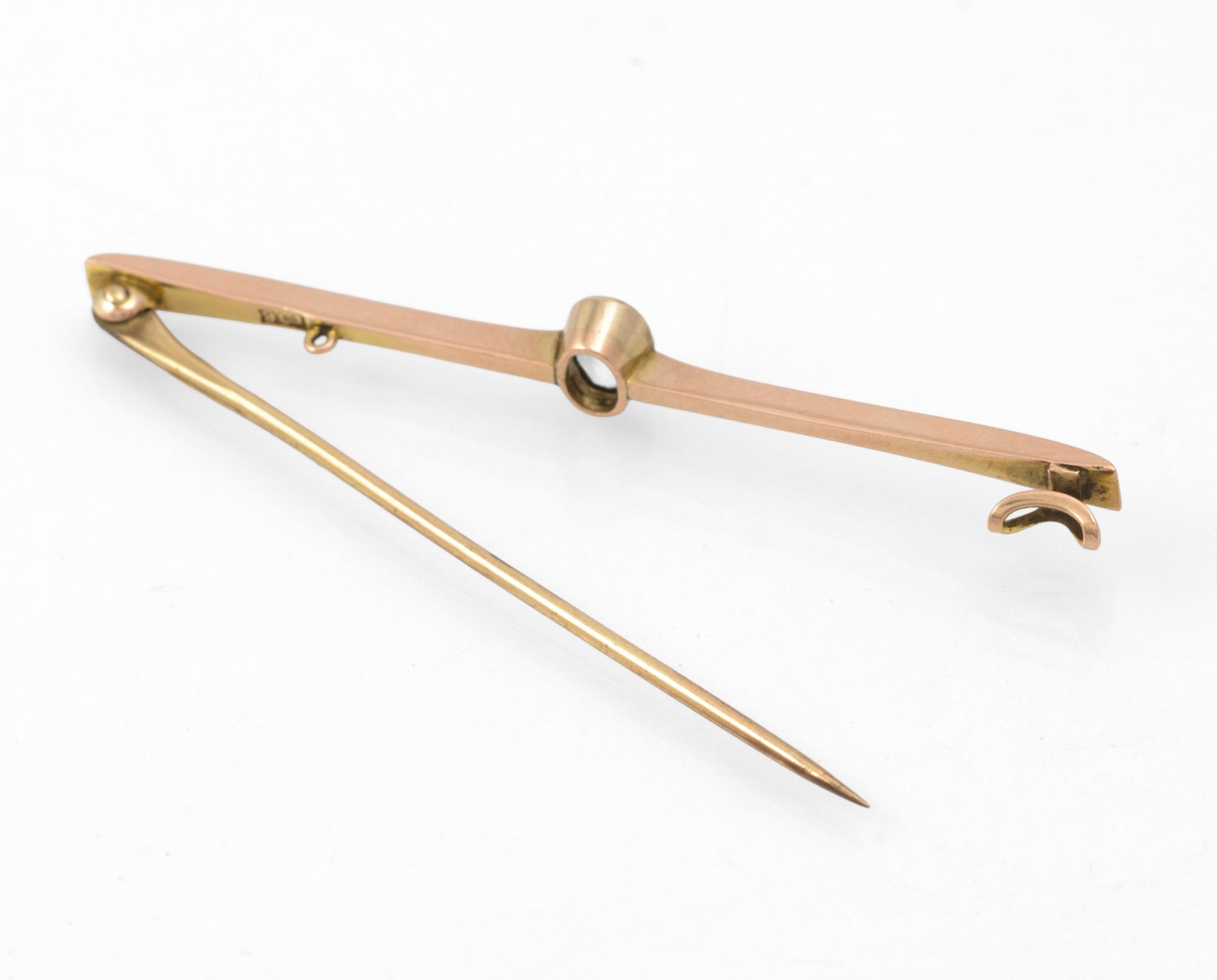 Art Deco 9ct rose gold aquamarine bar brooch - close-up of hallmark showing 9ct mark struck to reverse of bar