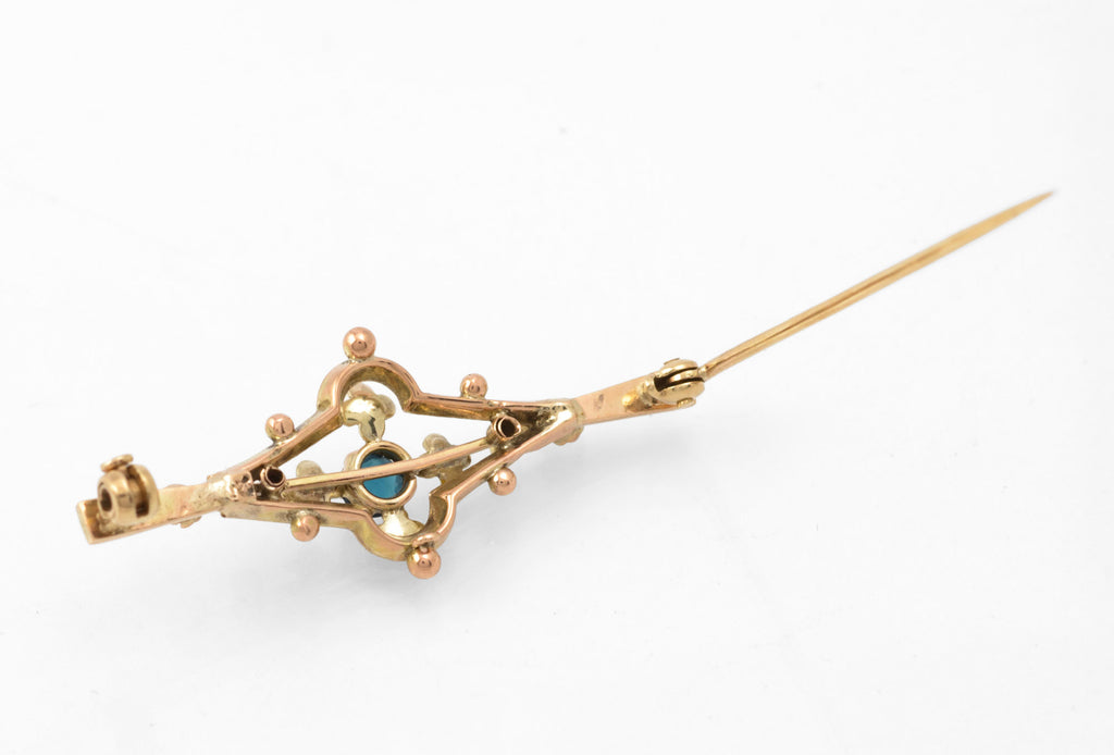 Antique 9ct gold bar brooch - reverse angled view showing pin open and clasp detail with cast mark visible on bar
