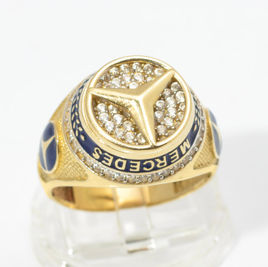 14ct gold Mercedes-Benz motorsport ring - close-up of head showing pave CZ three-pointed star and blue enamel band