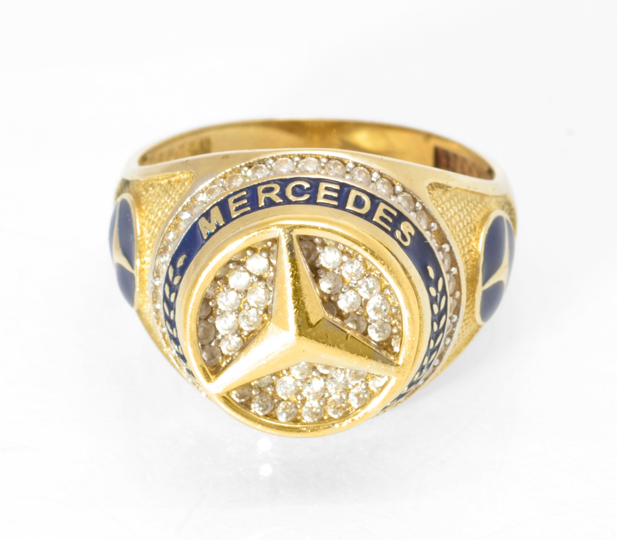 14ct gold Mercedes-Benz motorsport ring - top view showing full pave CZ head with three-pointed star and MERCEDES BENZ enamel surround