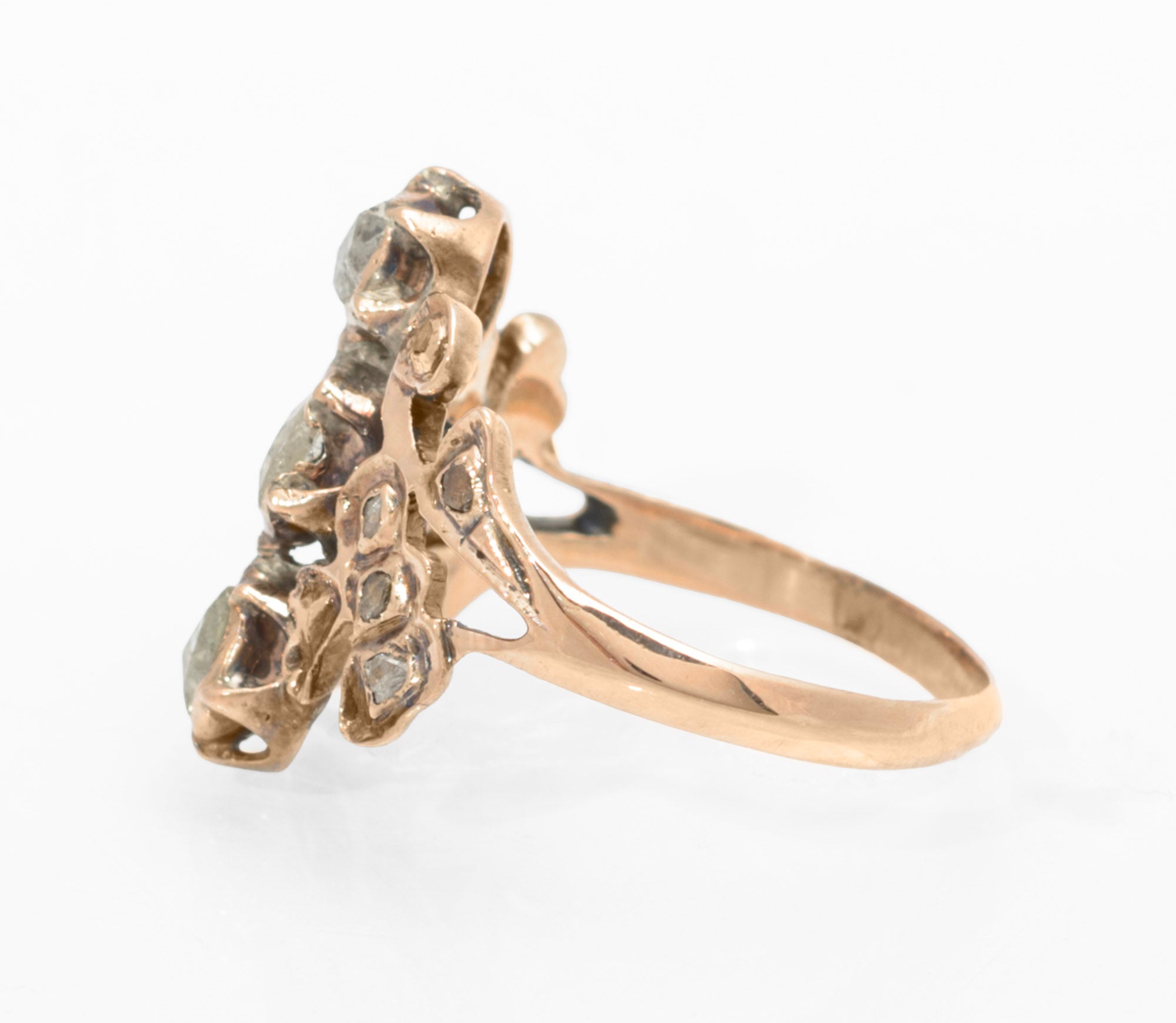 Georgian gold and diamond cluster ring - front view on ring stand showing full cluster head and band