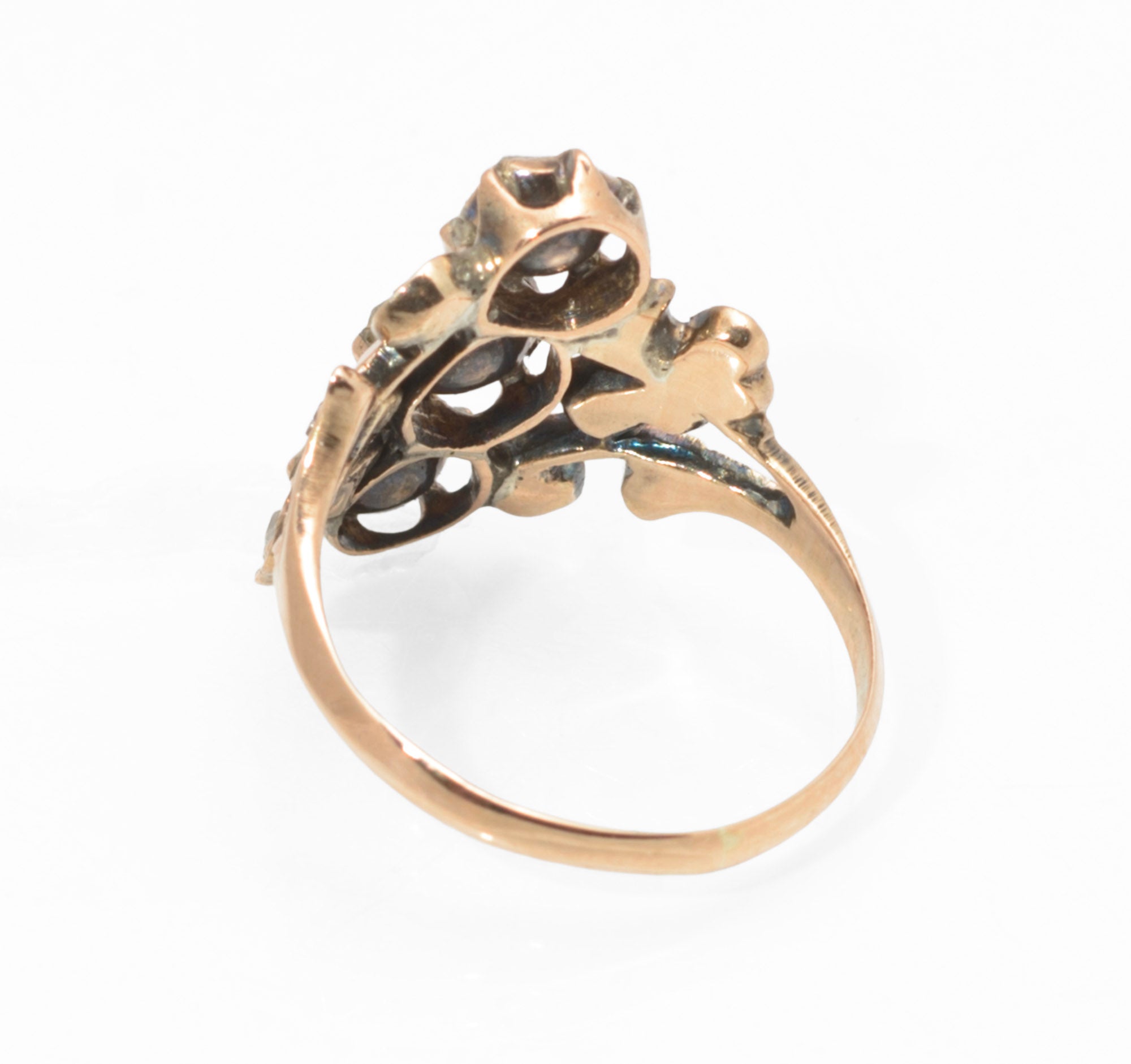 Georgian gold and diamond cluster ring - three-quarter view on ring stand showing cluster depth and open mount detail