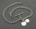 Antique Edwardian sterling silver double Albert watch chain 1908 - close up of dog clip showing lion sterling mark and swivel fitting on graduated curb links