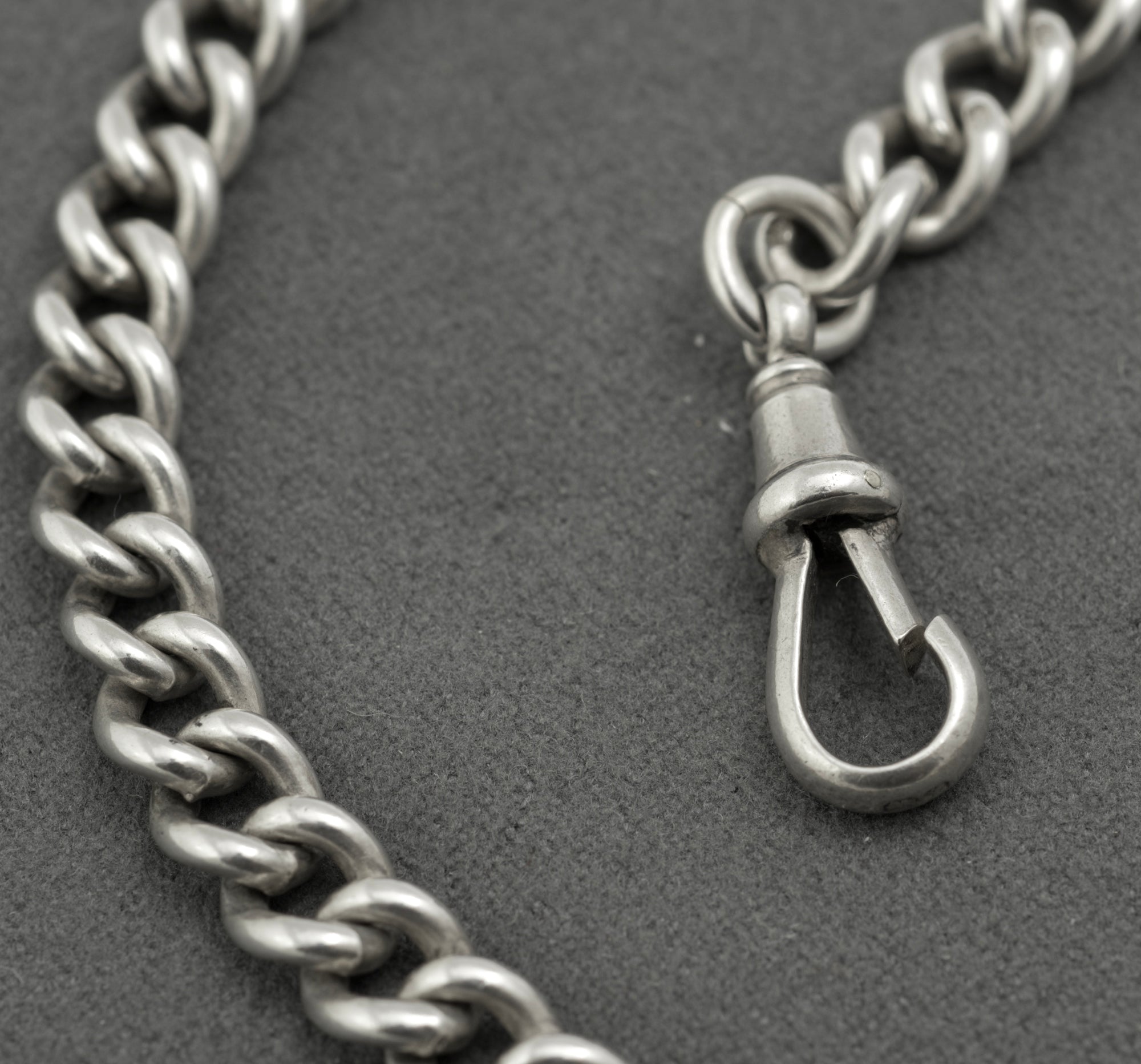 Antique sterling silver double Albert chain - close up of T-bar and dog clip junction showing sponsor's marks and graduated curb link detail