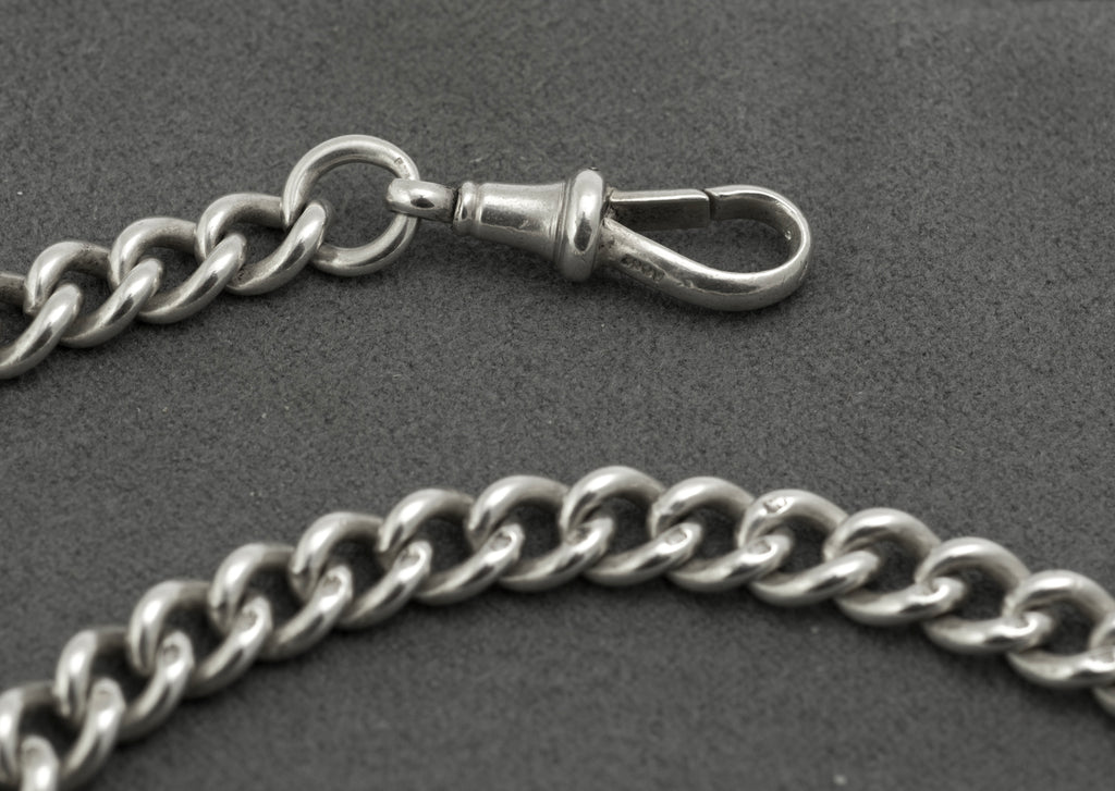 Antique sterling silver double Albert chain - close up of coin drops showing British 1910 sixpence reverse inscribed SIX PENCE and Australian 1910 threepence reverse