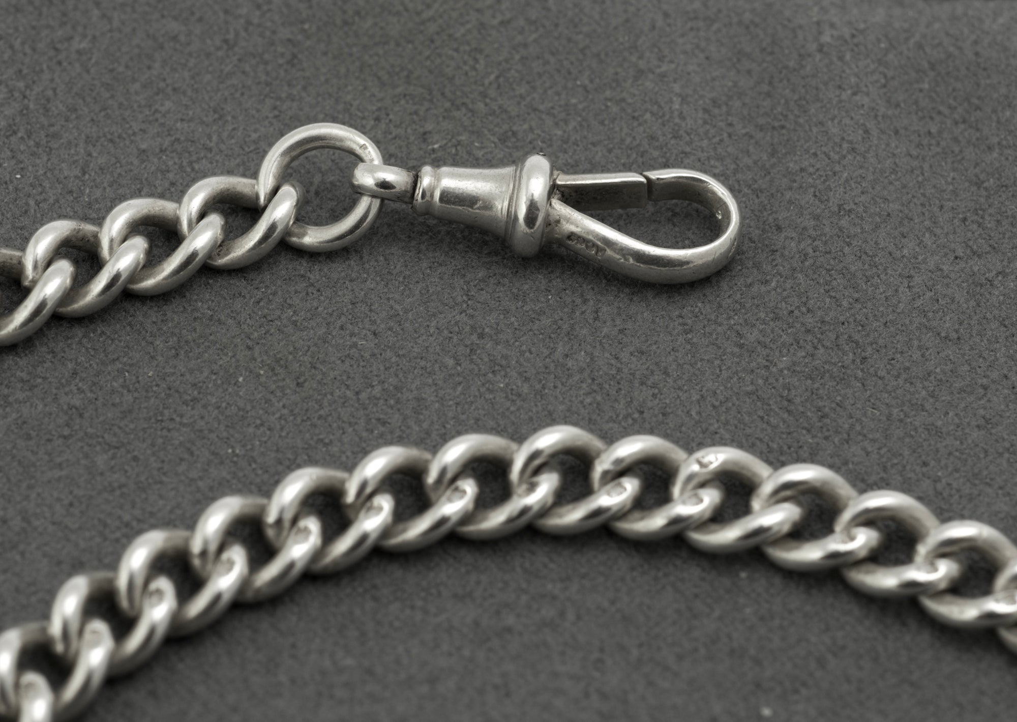 Antique sterling silver double Albert chain - close up of coin drops showing British 1910 sixpence reverse inscribed SIX PENCE and Australian 1910 threepence reverse