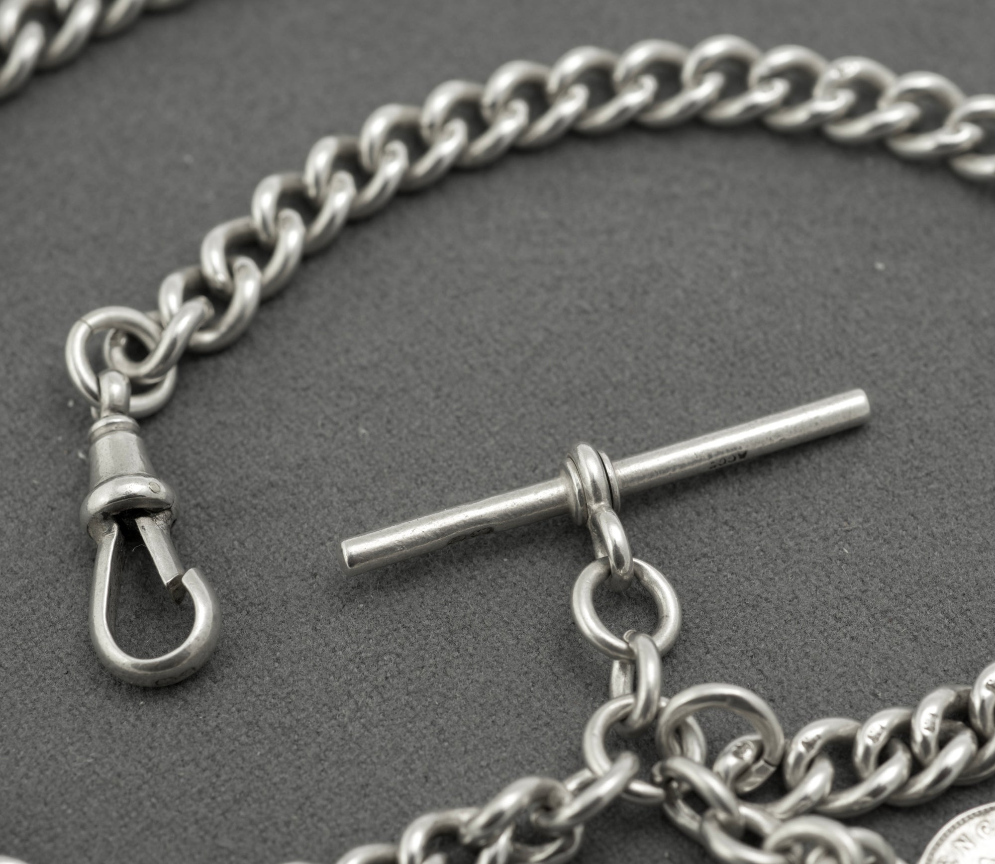 Antique sterling silver double Albert chain - full length view on white background showing chain configured as necklace approximately 39cm with T-bar and coin drops