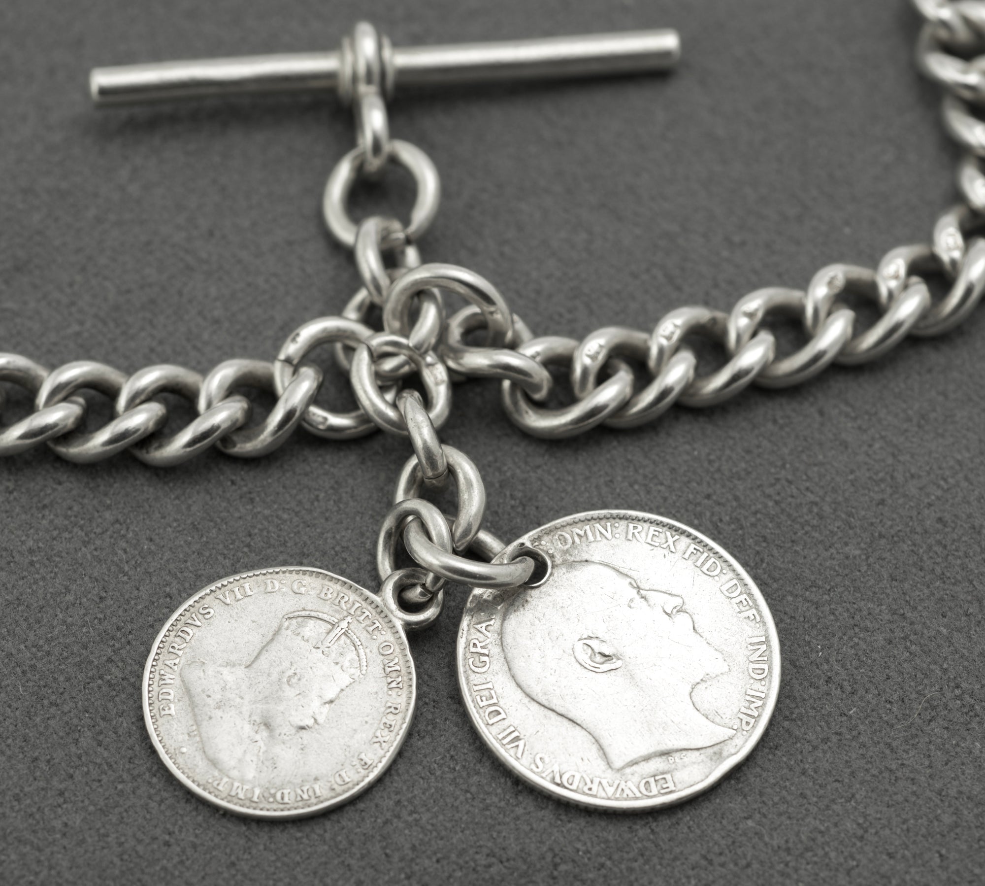 Antique sterling silver double Albert chain - detail of individual curb links showing lion sterling hallmarks struck to each link