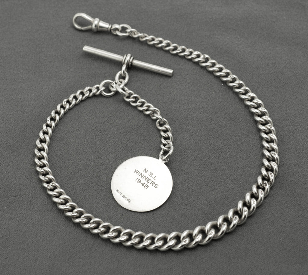 Antique Victorian sterling silver Albert chain - detail of graduated curb links showing individual lion sterling marks and widening towards centre
