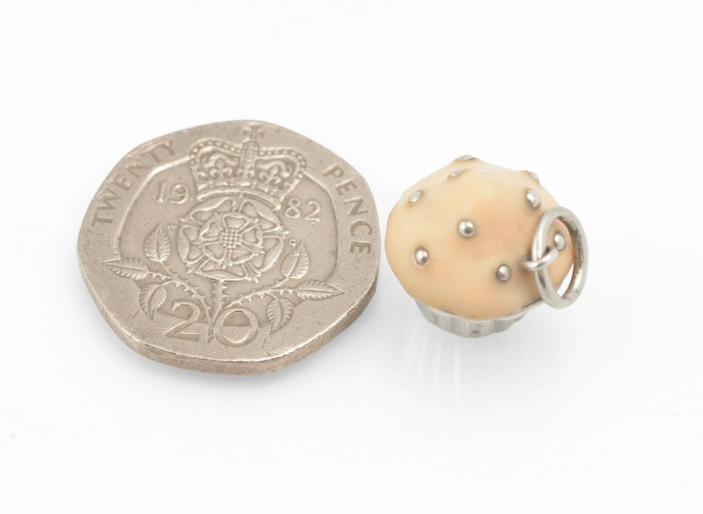 Vintage Tiffany & Co. sterling silver cupcake charm - scale reference with 20p coin showing 13mm size of charm
