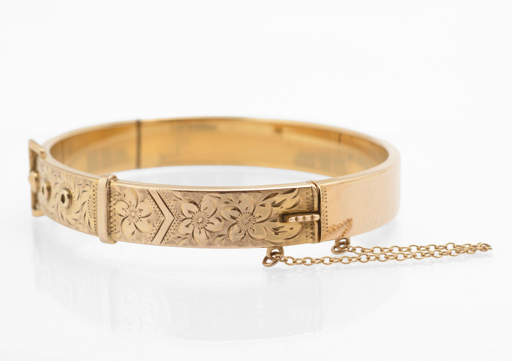 Edwardian gold metal cored buckle bangle - alternative front view showing raised circular adjustment hole details and engraved foliate decoration