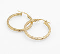 Vintage 9ct gold Unoaerre rope twist hoop earrings - three quarter view showing angular twist pattern and hinged lever fittings open