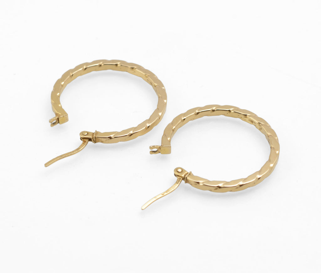 Vintage 9ct gold Unoaerre hoop earrings - side view showing hoop profile and hinged lever catch mechanism