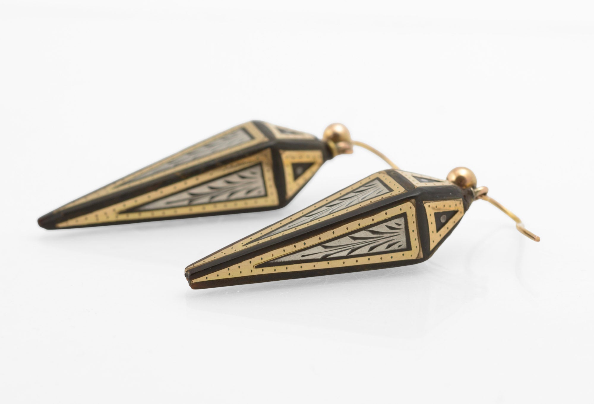 Antique Victorian piqué work earrings - displayed on earring stand showing full drop length and obelisk form