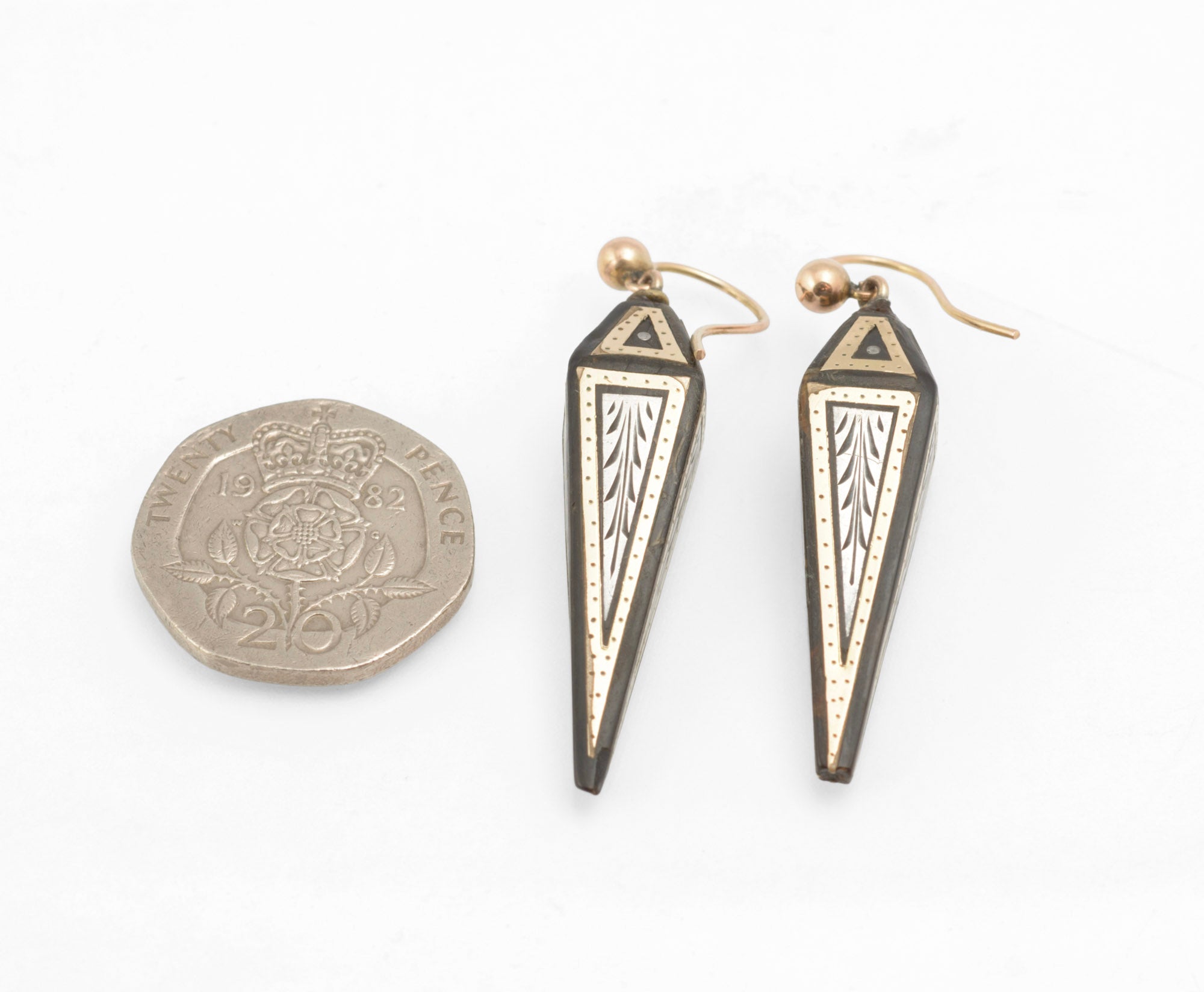 Antique Victorian piqué work earrings - close up detail of silver engraved stylised leaf and feather motifs within gold bordered panels