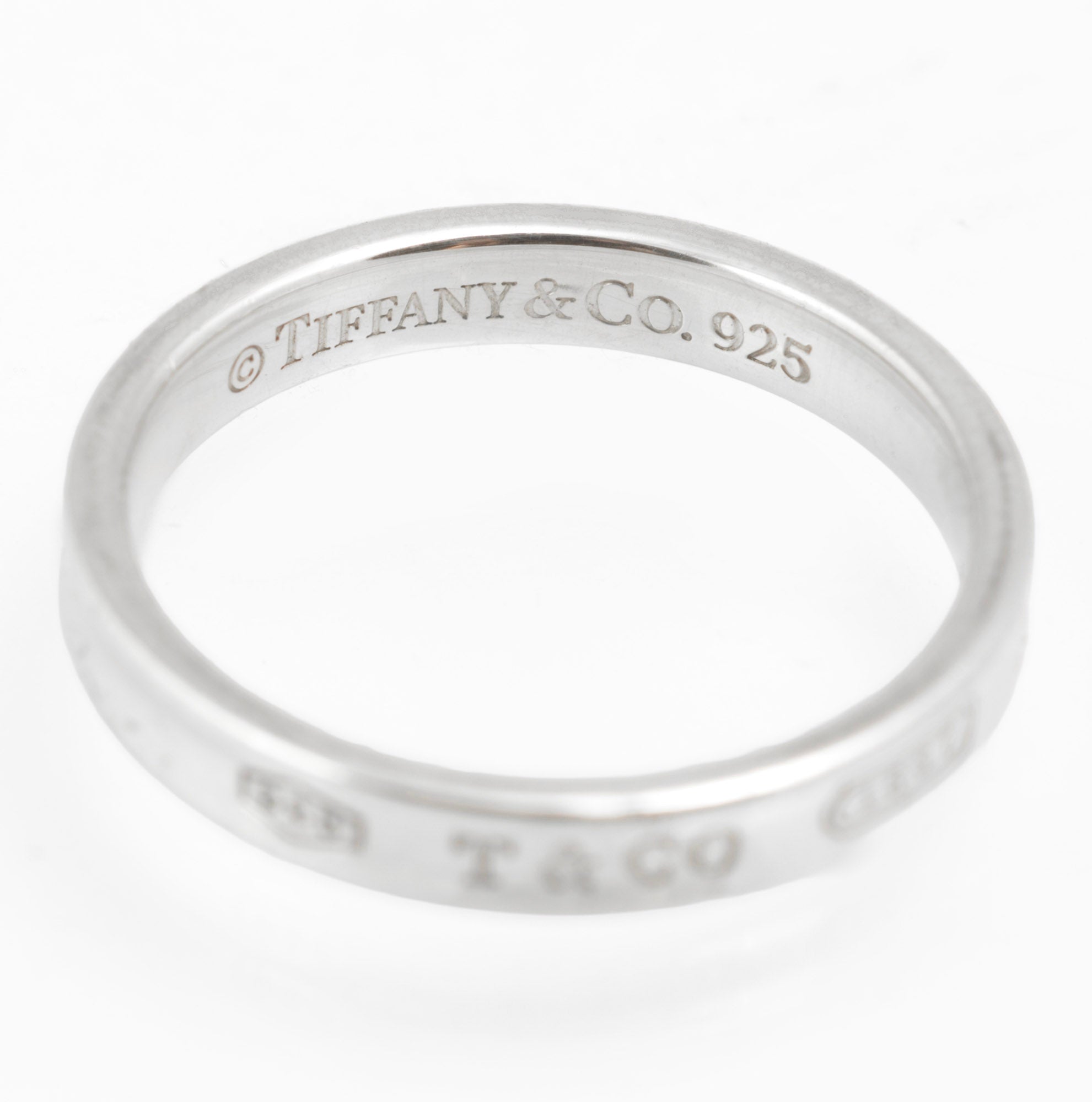 Vintage Tiffany & Co. 1837 sterling silver band ring - interior view showing engraved copyright Tiffany & Co. 925 mark