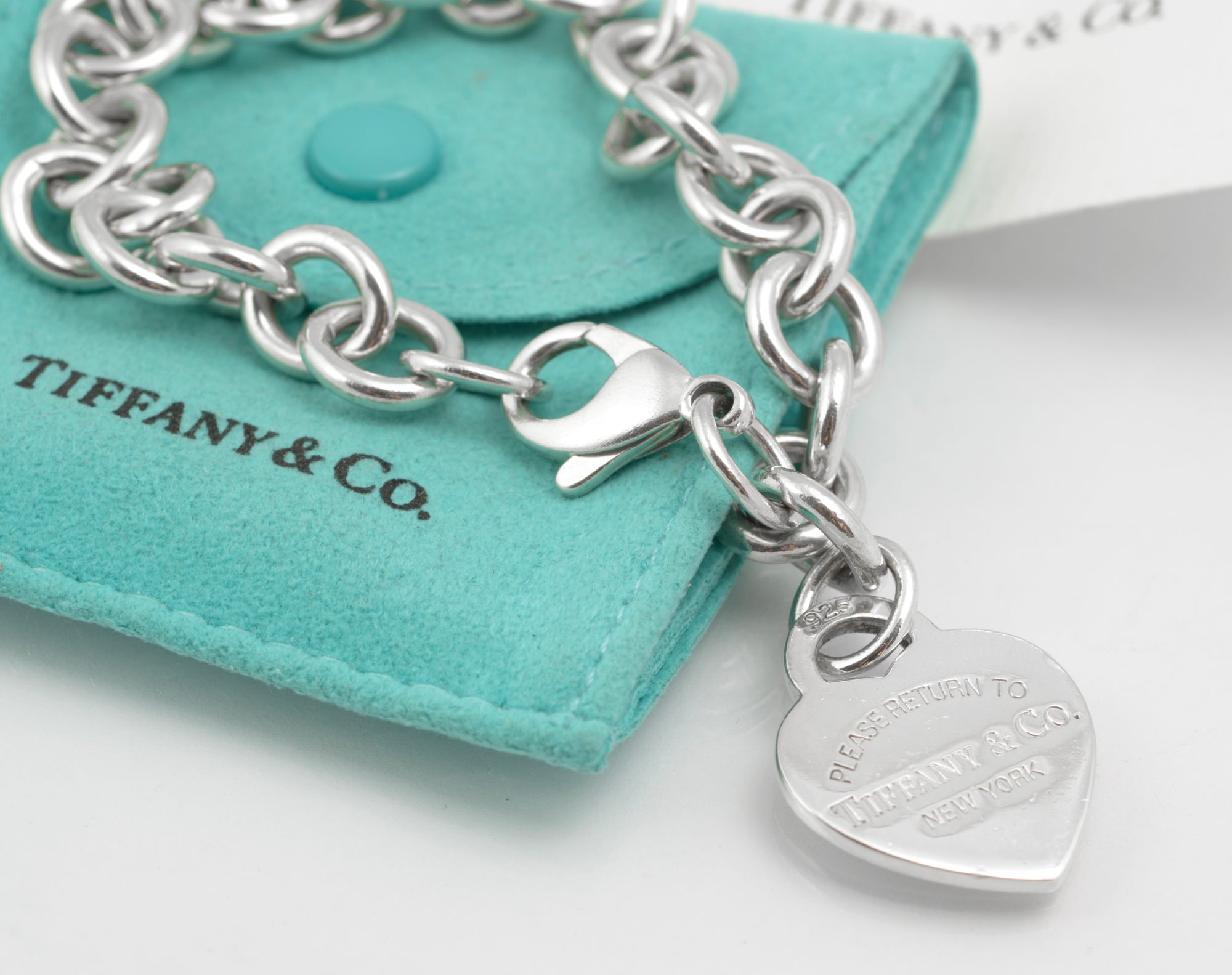 Tiffany & Co. Return to Tiffany bracelet - close-up of heart tag showing Please Return to Tiffany & Co. New York stamped lettering