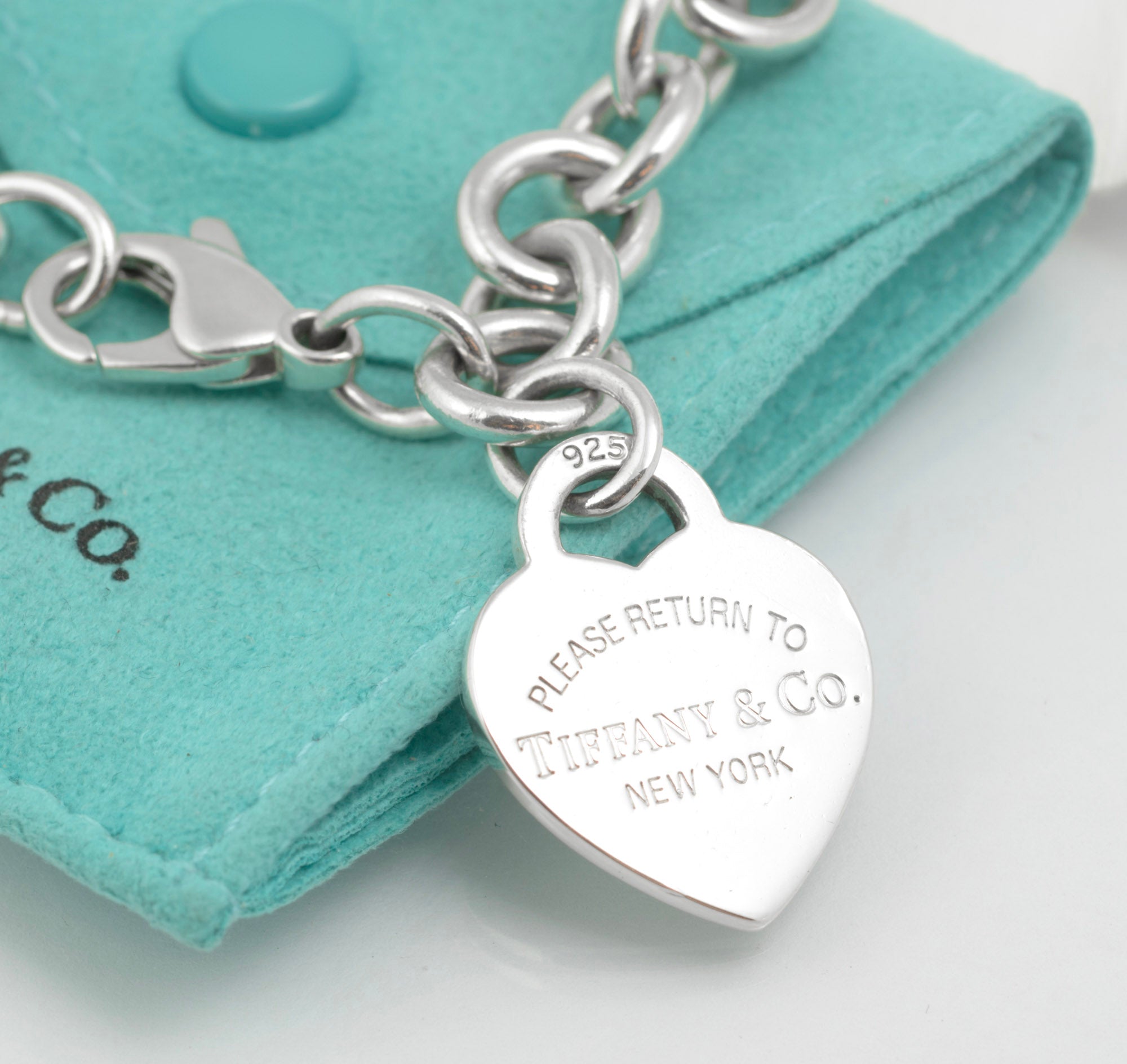 Tiffany & Co. Return to Tiffany bracelet on blue pouch - angled view showing lobster clasp end and link construction