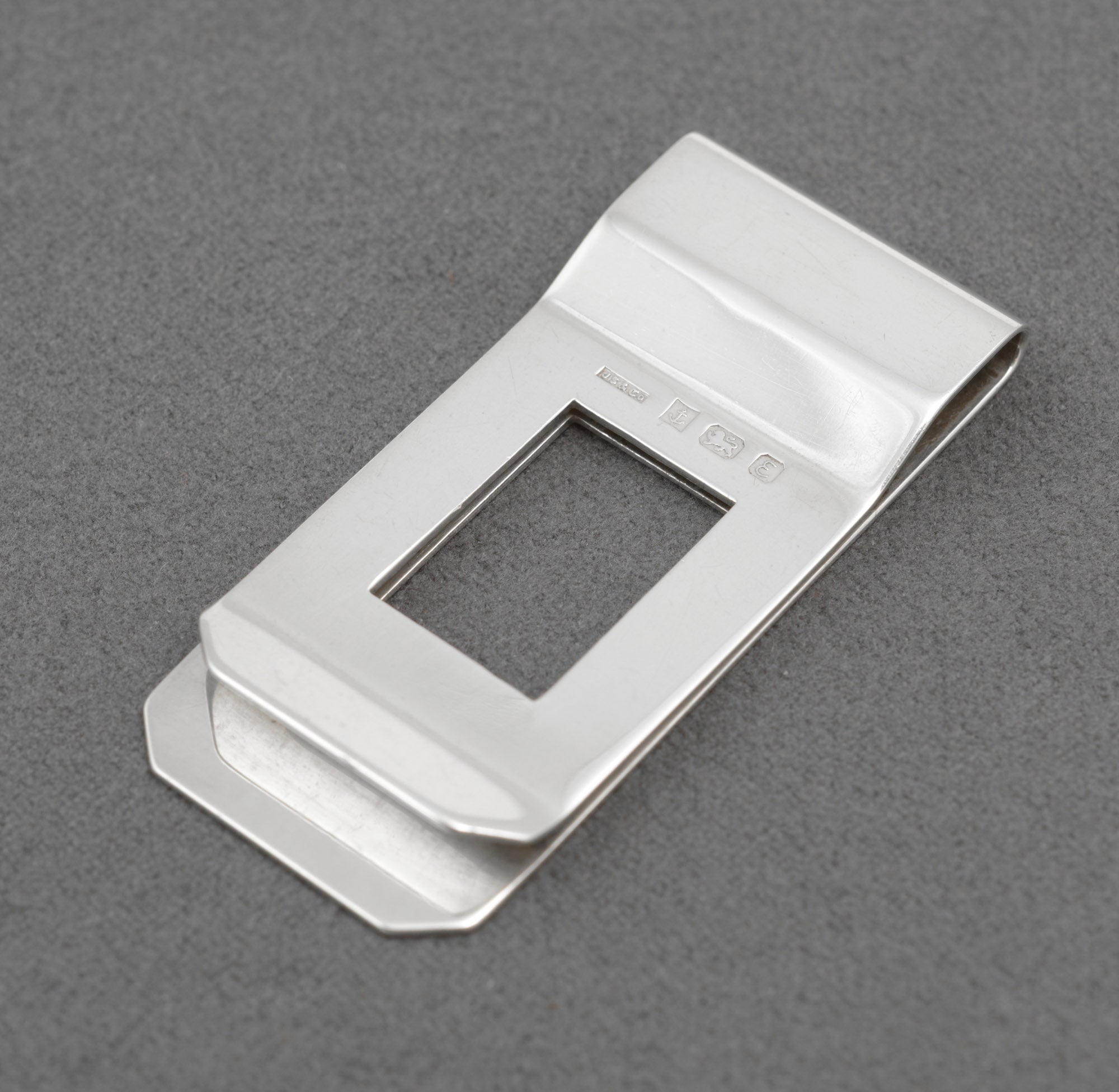 Vintage sterling silver money clip - reverse showing plain polished finish with Birmingham 1979 hallmarks and JS & Co maker's mark