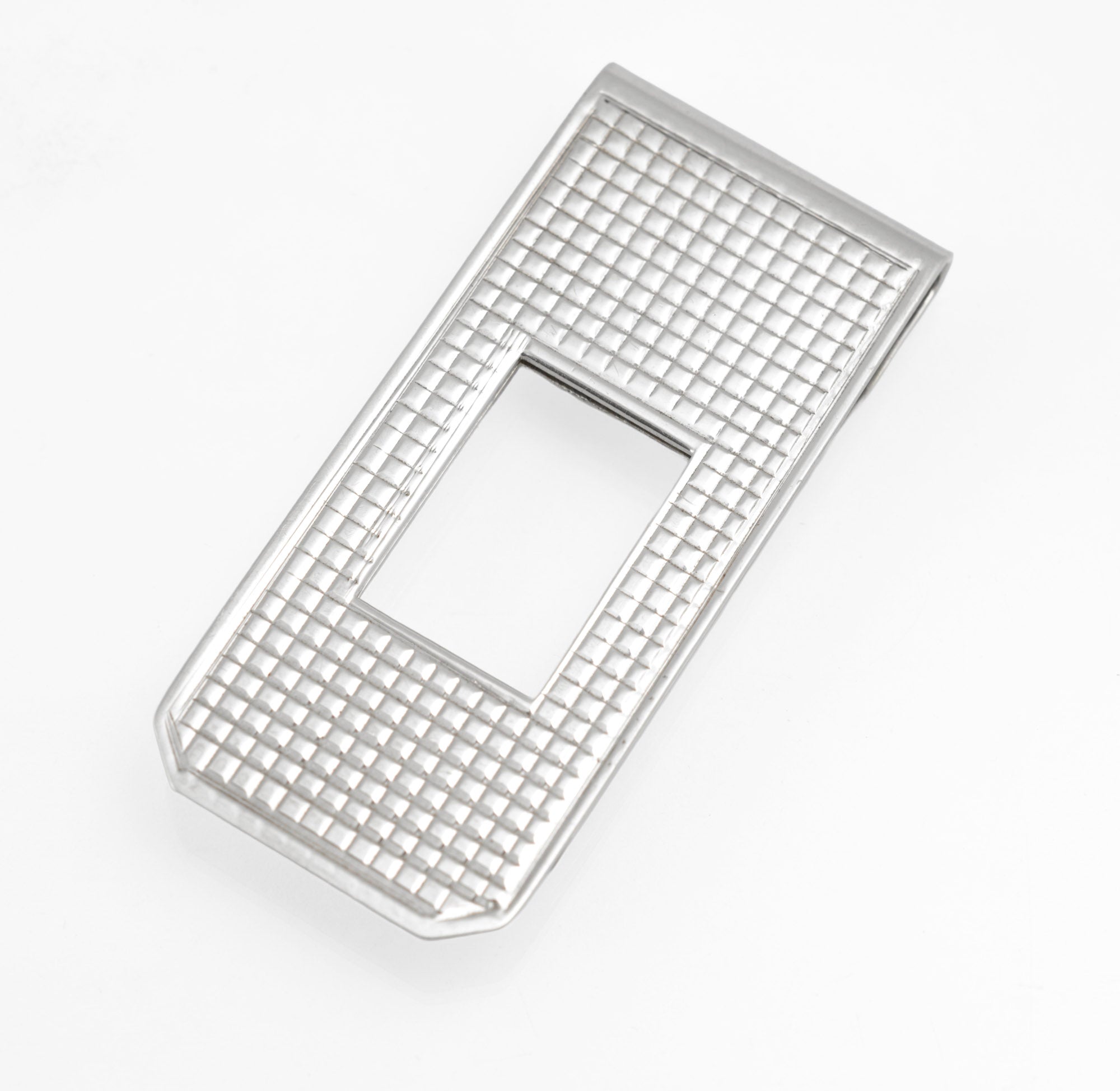 Vintage sterling silver money clip - side profile on grey background showing slim folded spring construction and clip mechanism