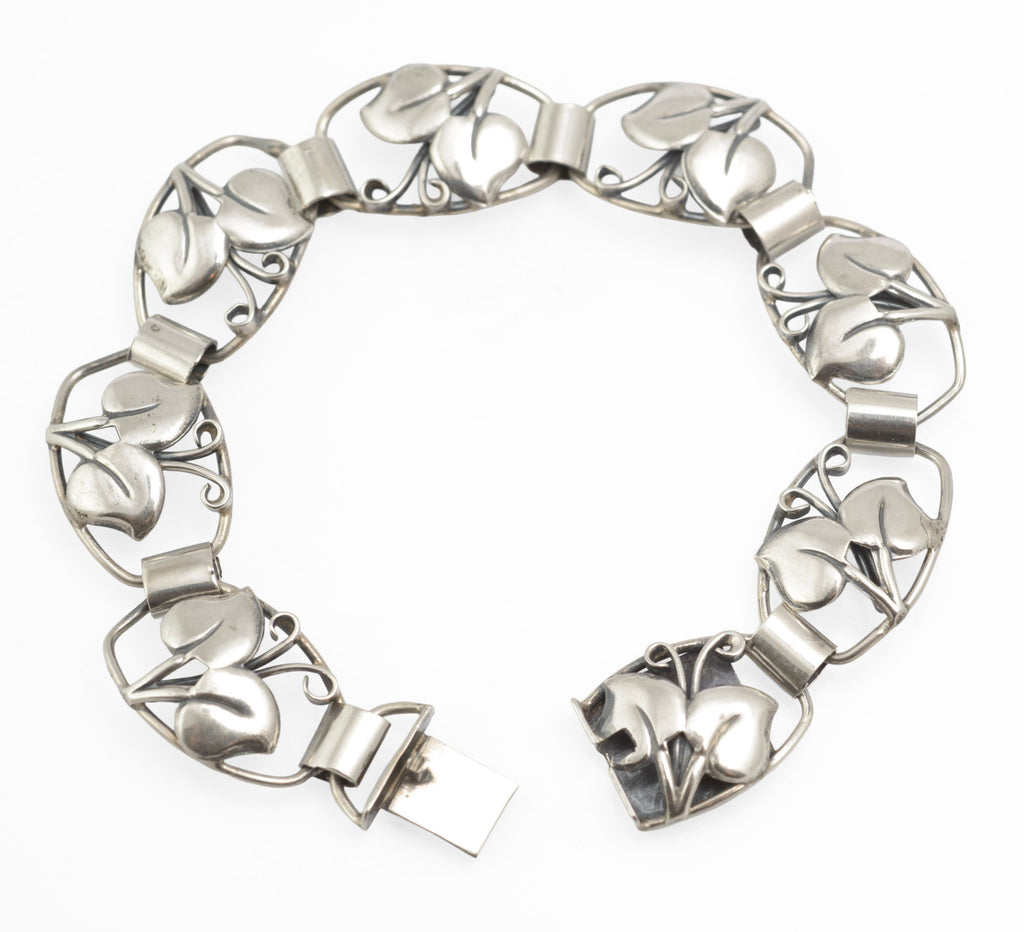 Vintage Danish 830 silver bracelet by Arne Henning Petersen - close-up of foliate openwork panels showing raised leaves and curling tendrils