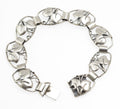 Vintage Danish 830 silver bracelet by Arne Henning Petersen - close-up of foliate openwork panels showing raised leaves and curling tendrils