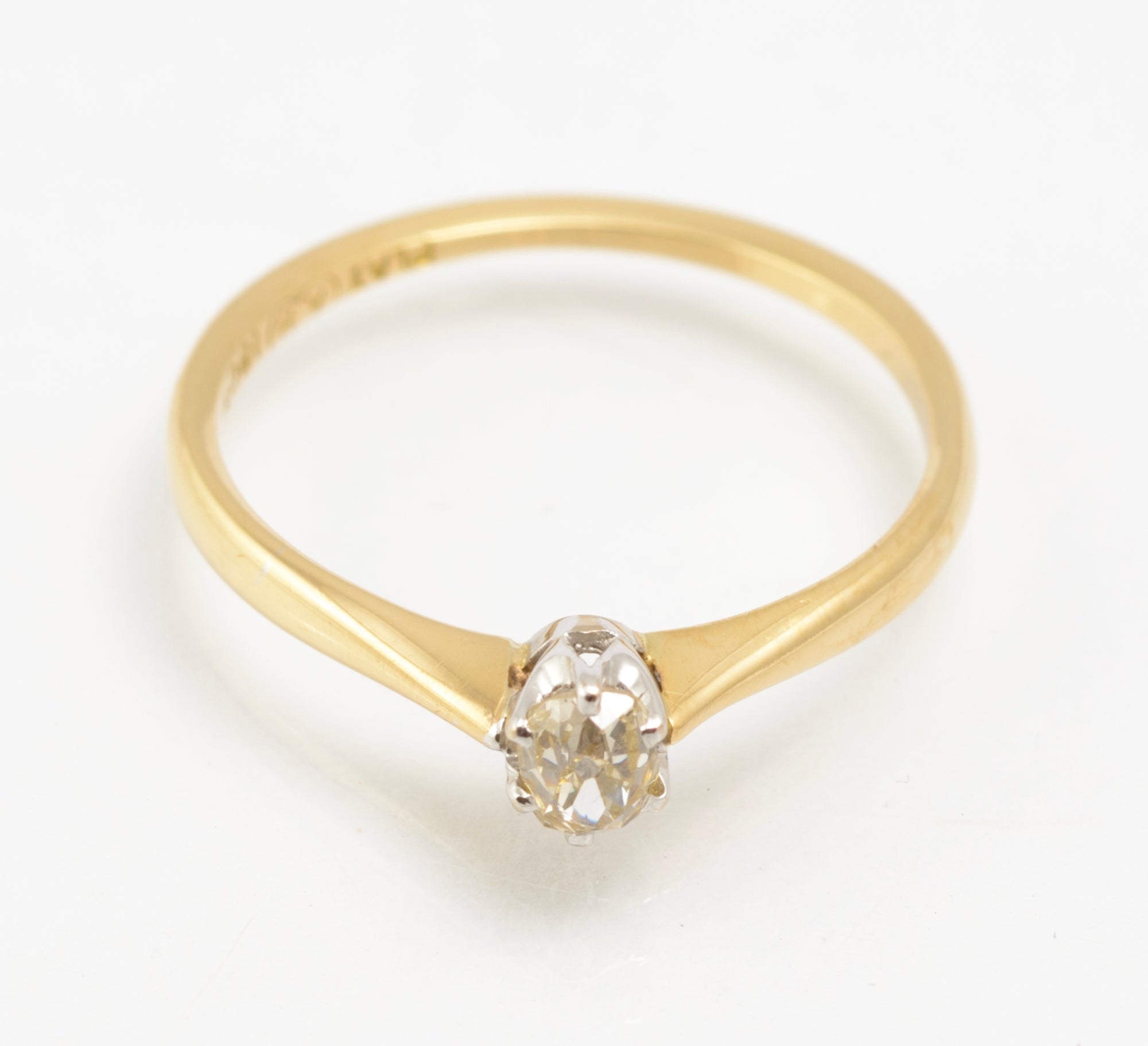 An antique 1920s diamond solitaire ring in 18ct yellow gold and platinum.