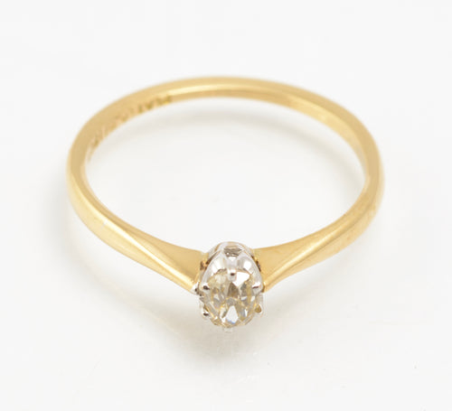 An antique 1920s diamond solitaire ring in 18ct yellow gold and platinum.
