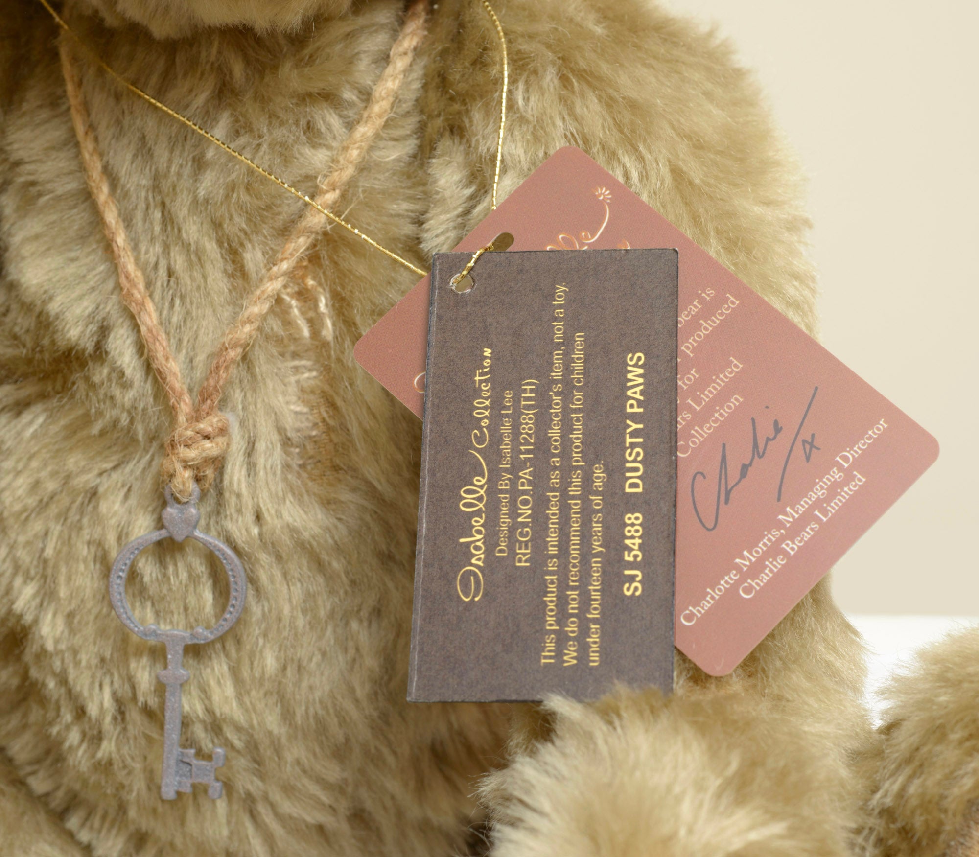 Charlie Bears Dusty Paws - Isabelle Collection - close up face showing dark glass eyes, grey hand-stitched nose and sandy mohair