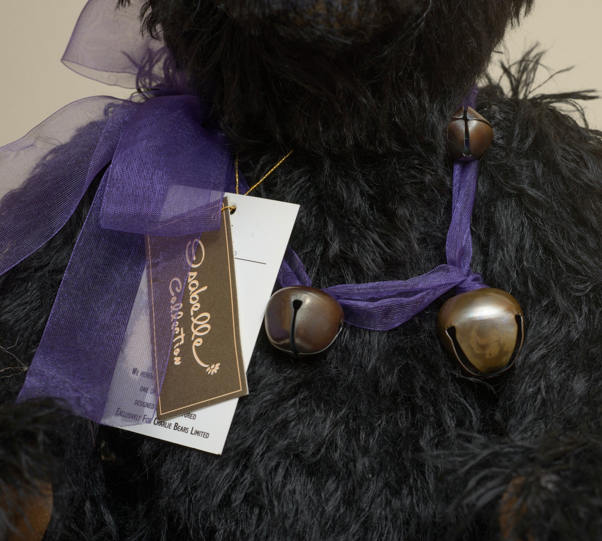 Charlie Bears Indigo - Isabelle Collection - rear view showing long black mohair coat and Isabelle Collection woven label sewn to lower back