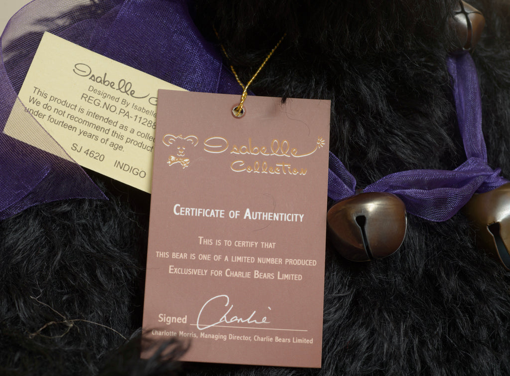 Charlie Bears Indigo - Isabelle Collection - close up of Isabelle Collection woven label reading Designed by Isabelle Lee in gold on brown
